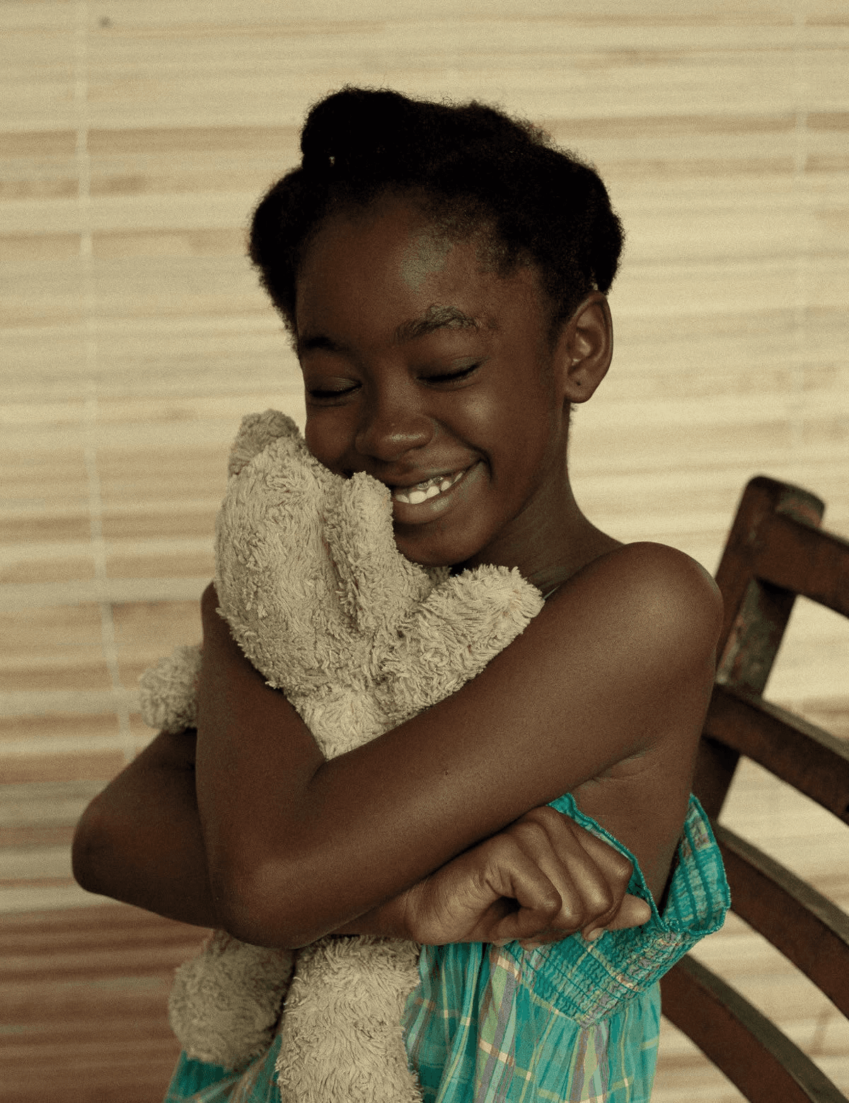 A girl hugging a teddybear
