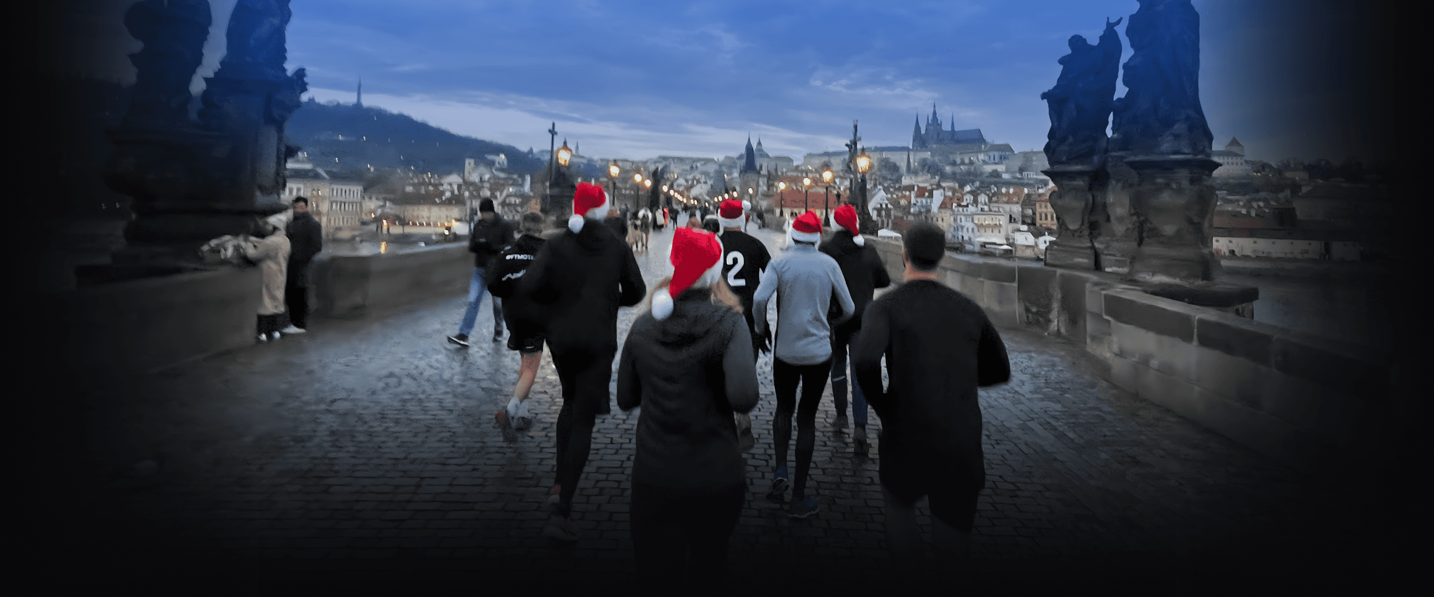 Group of people running on Charles Bridge