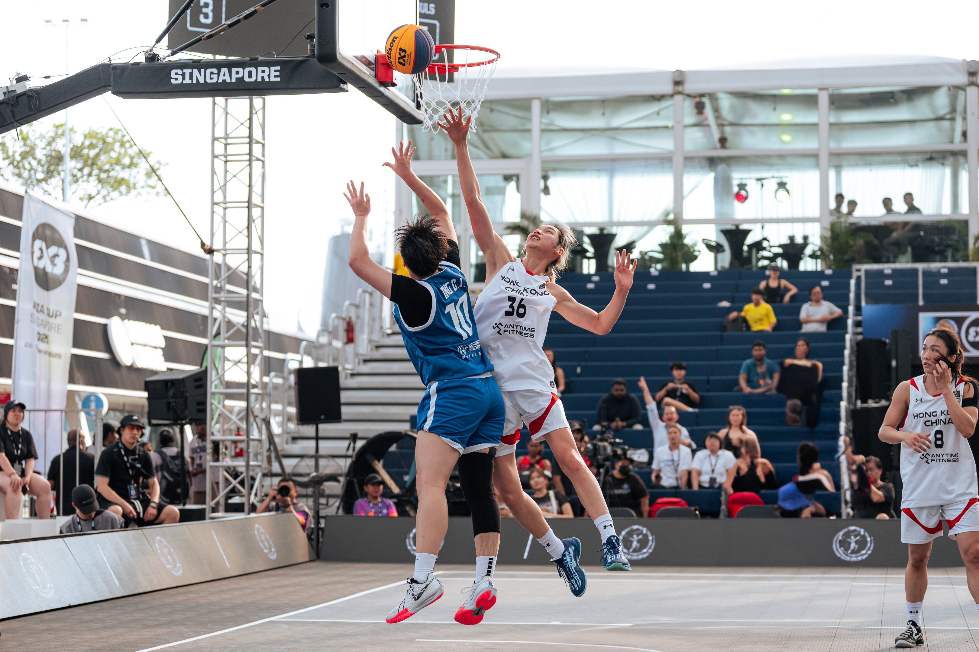 Players challenge for a ball during the FIBA 3x3 tournament in Singapore, 2025
