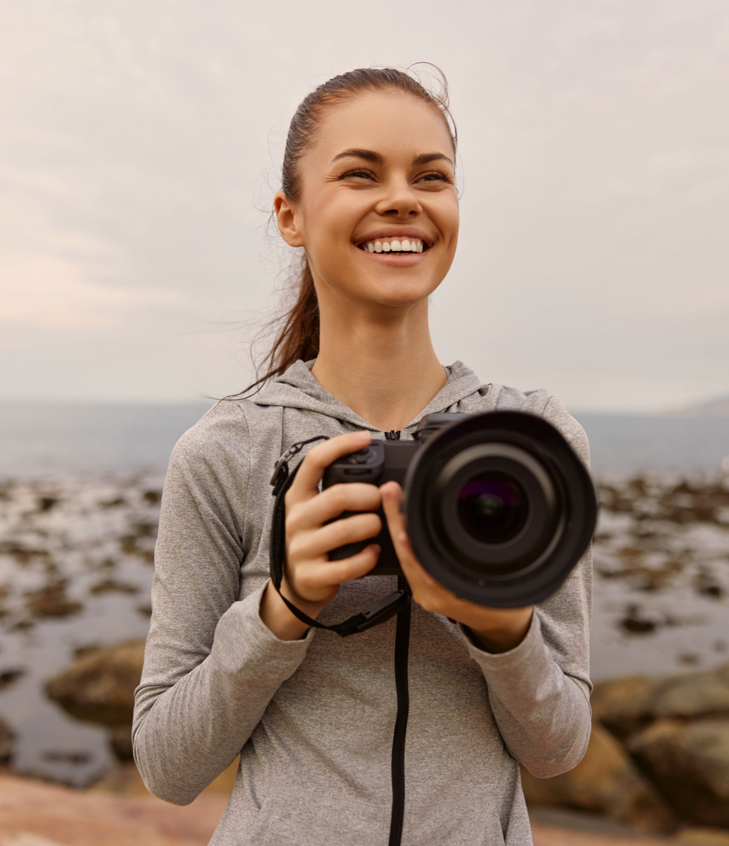 woman wearing a camera and smiling