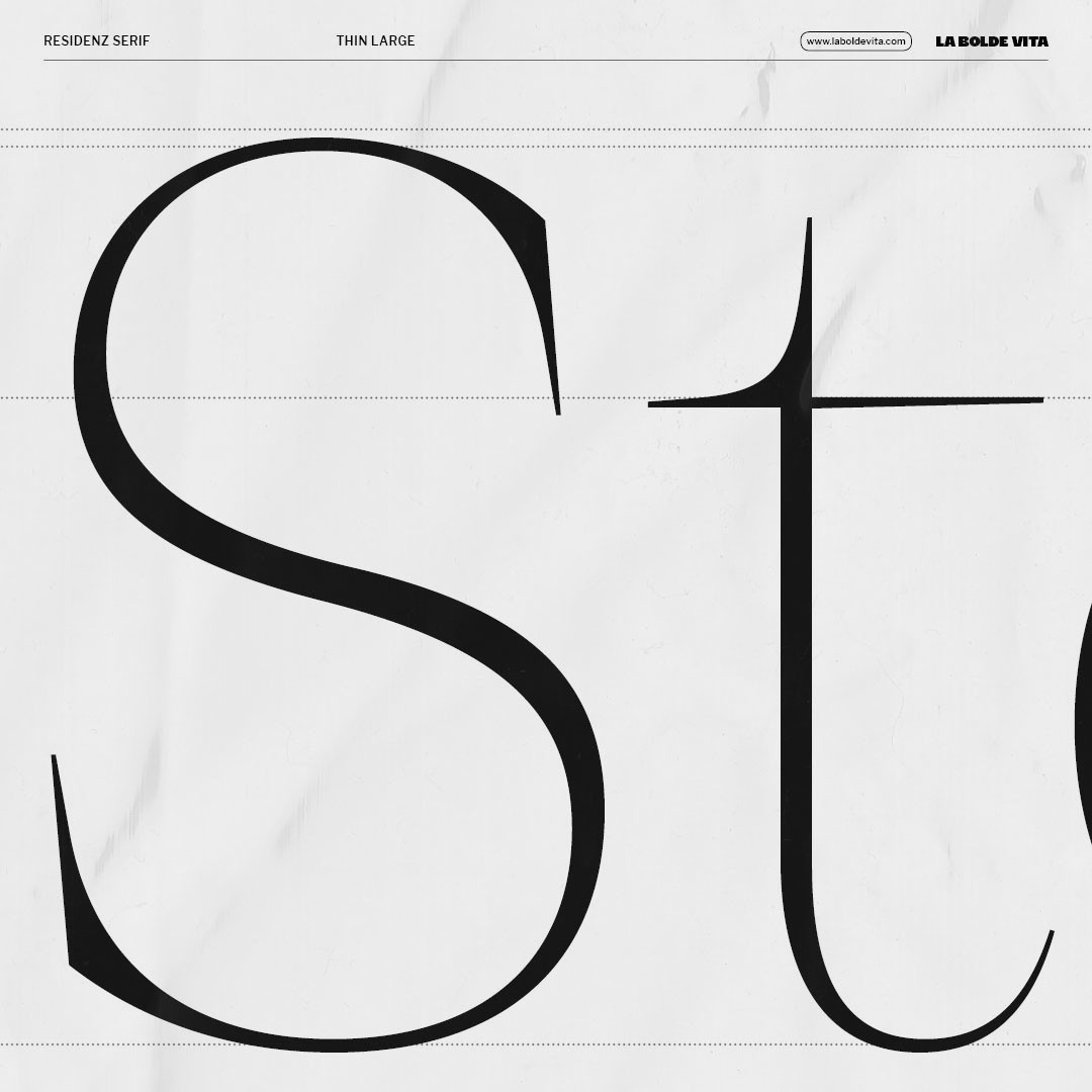 very close detail of "S" and "t" set in Residenz Serif Thin Large showing the sharp serifs and fine details of the font