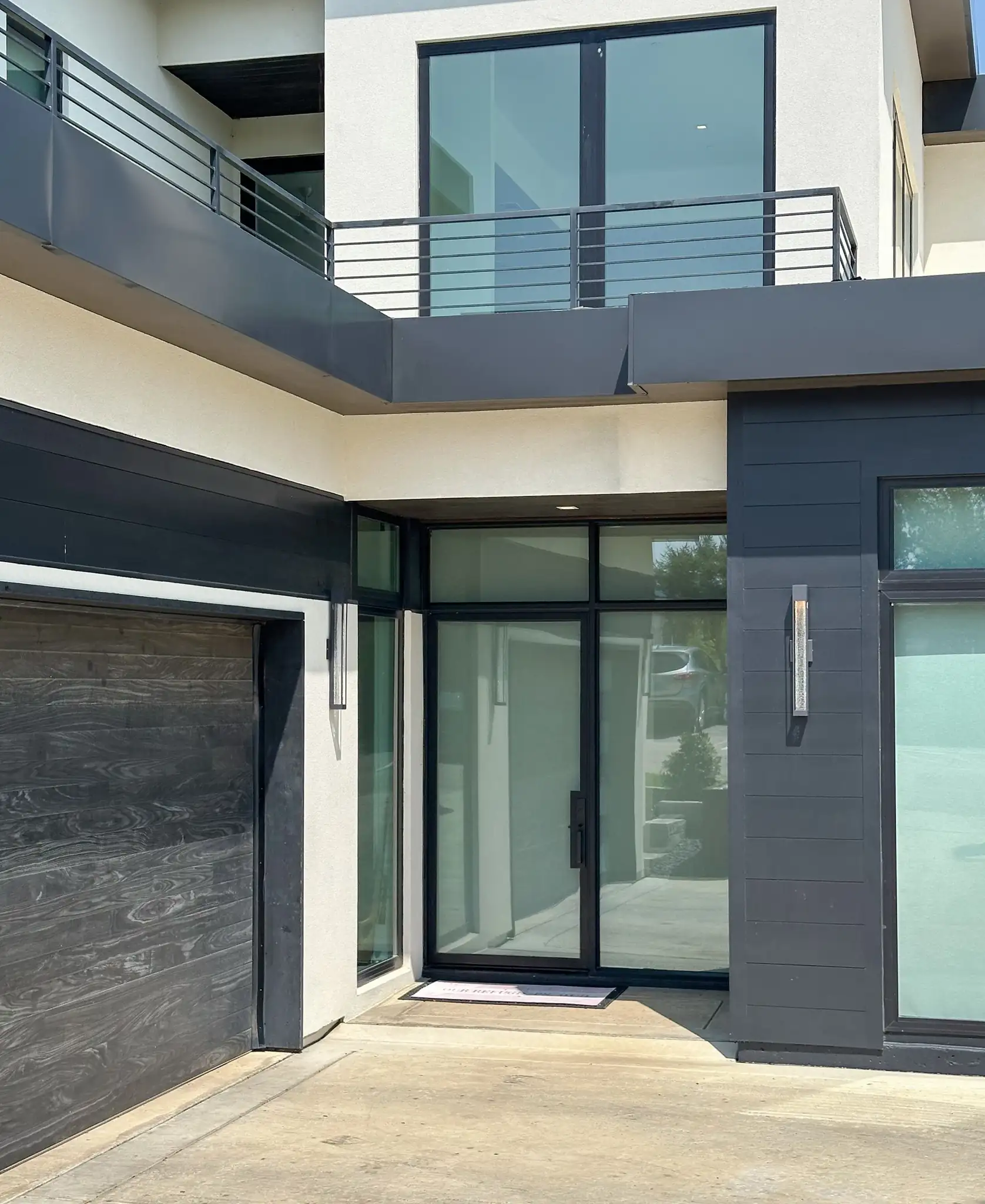 modern low profile door with side lite and frosted glass on a modern Southlake home