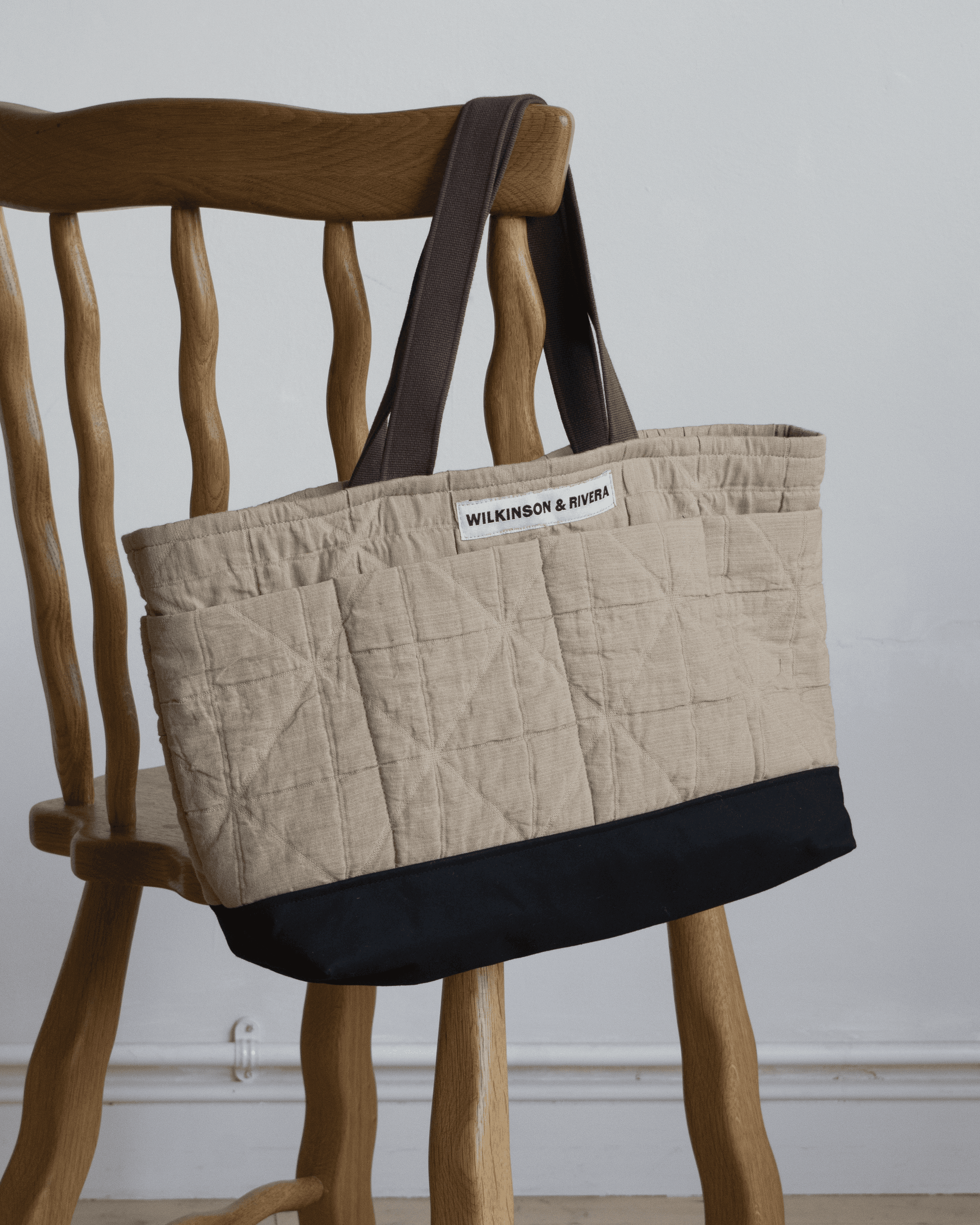 Limited edition Garden Tote from Wilkinson & Rivera in Cotton Jacquard hanging from chair