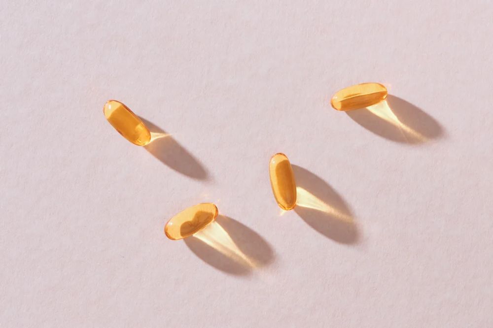 OxiNigella Blackseed oil capsules laying on counter