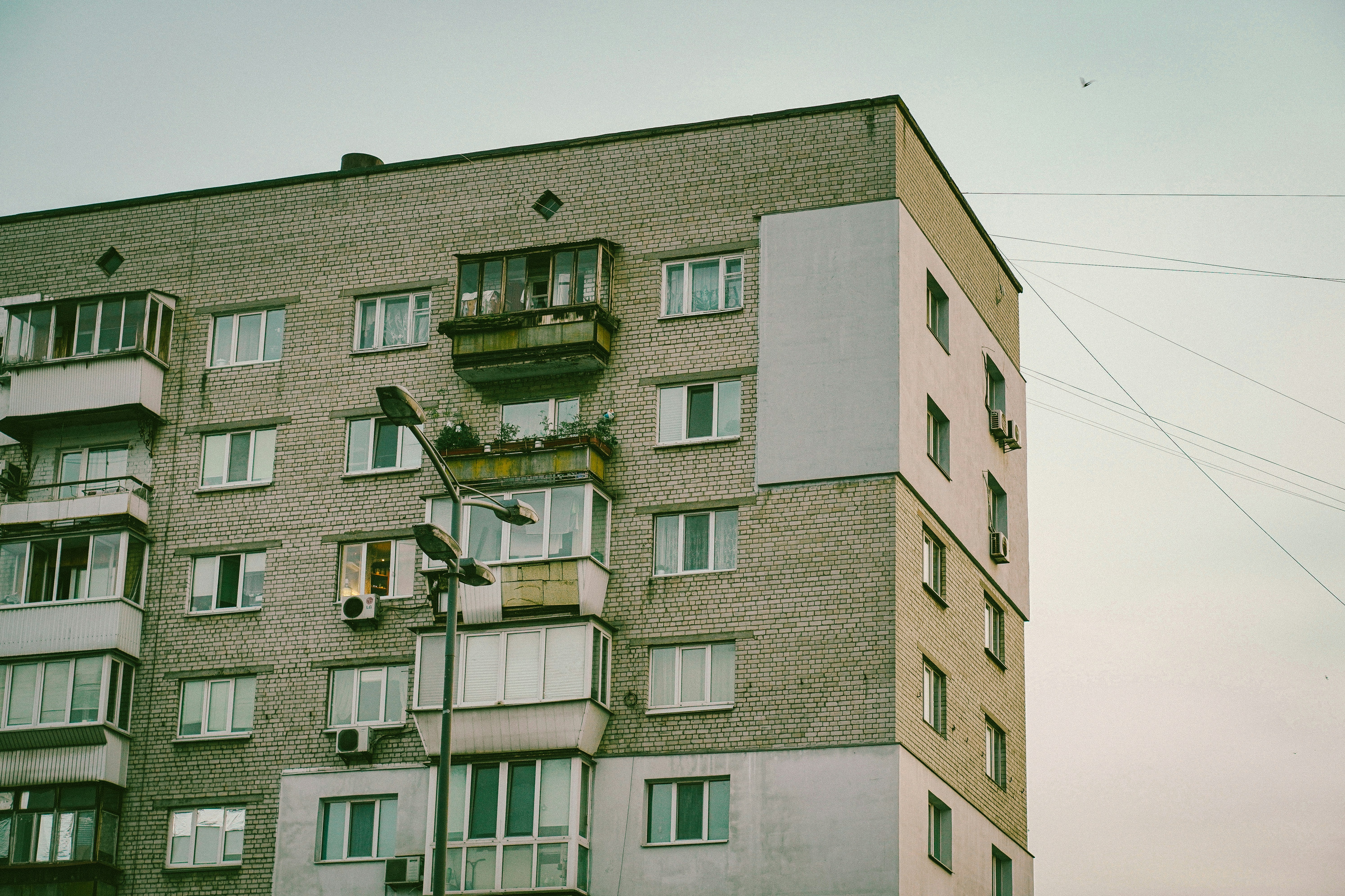 a tall building with a balcony and balconies