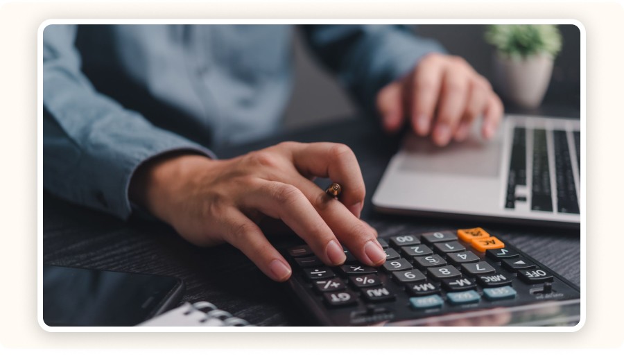 Hand using a calculator