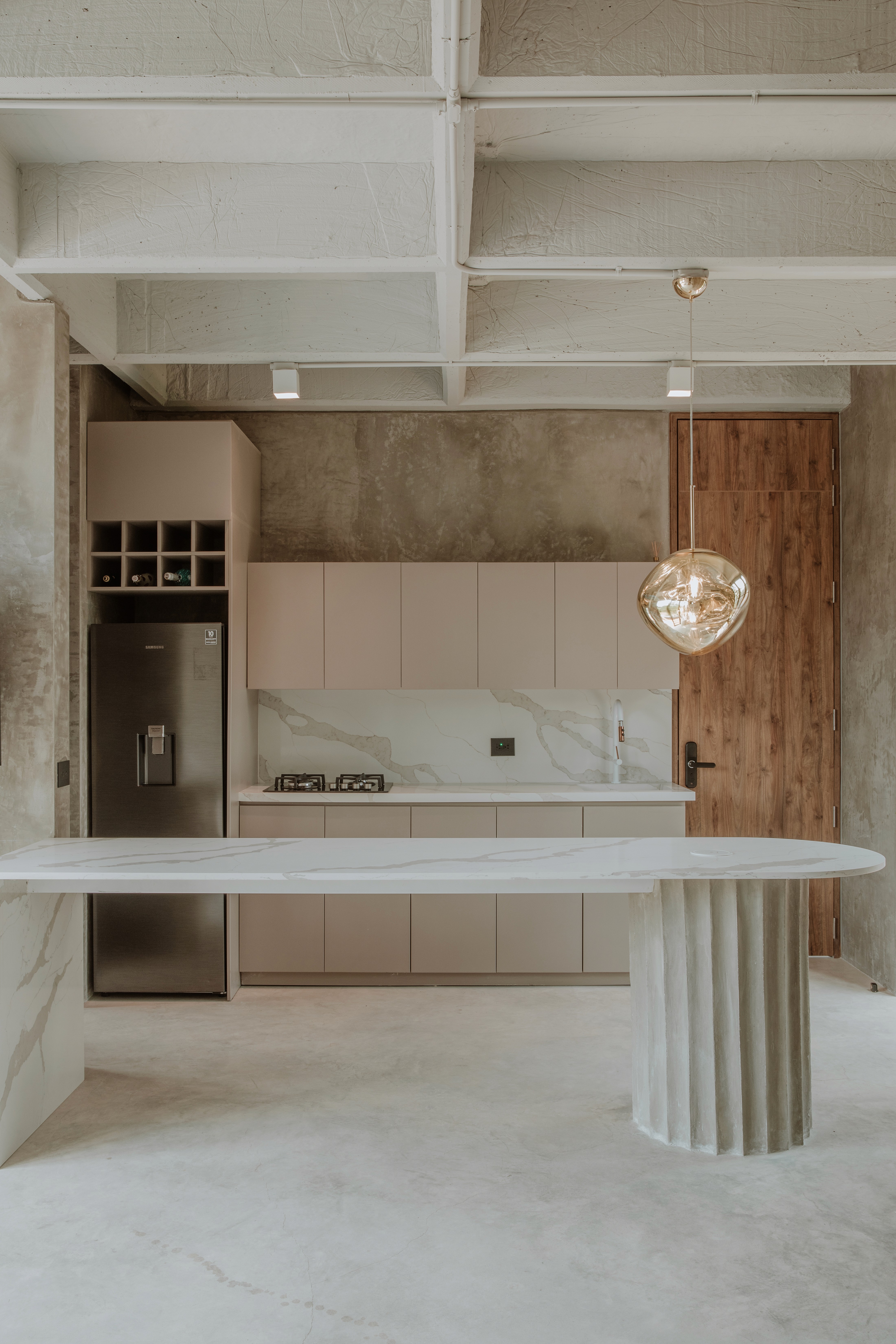Double-height interior with flowing sculptural forms and warm raking light