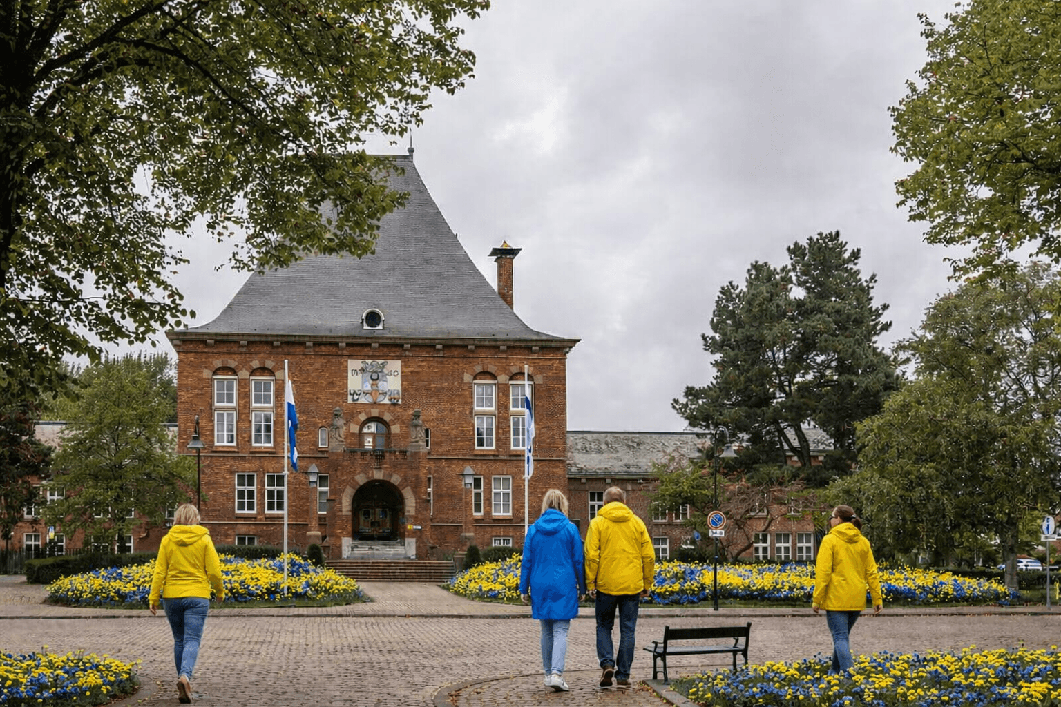 two people looking at a tablet and smiling