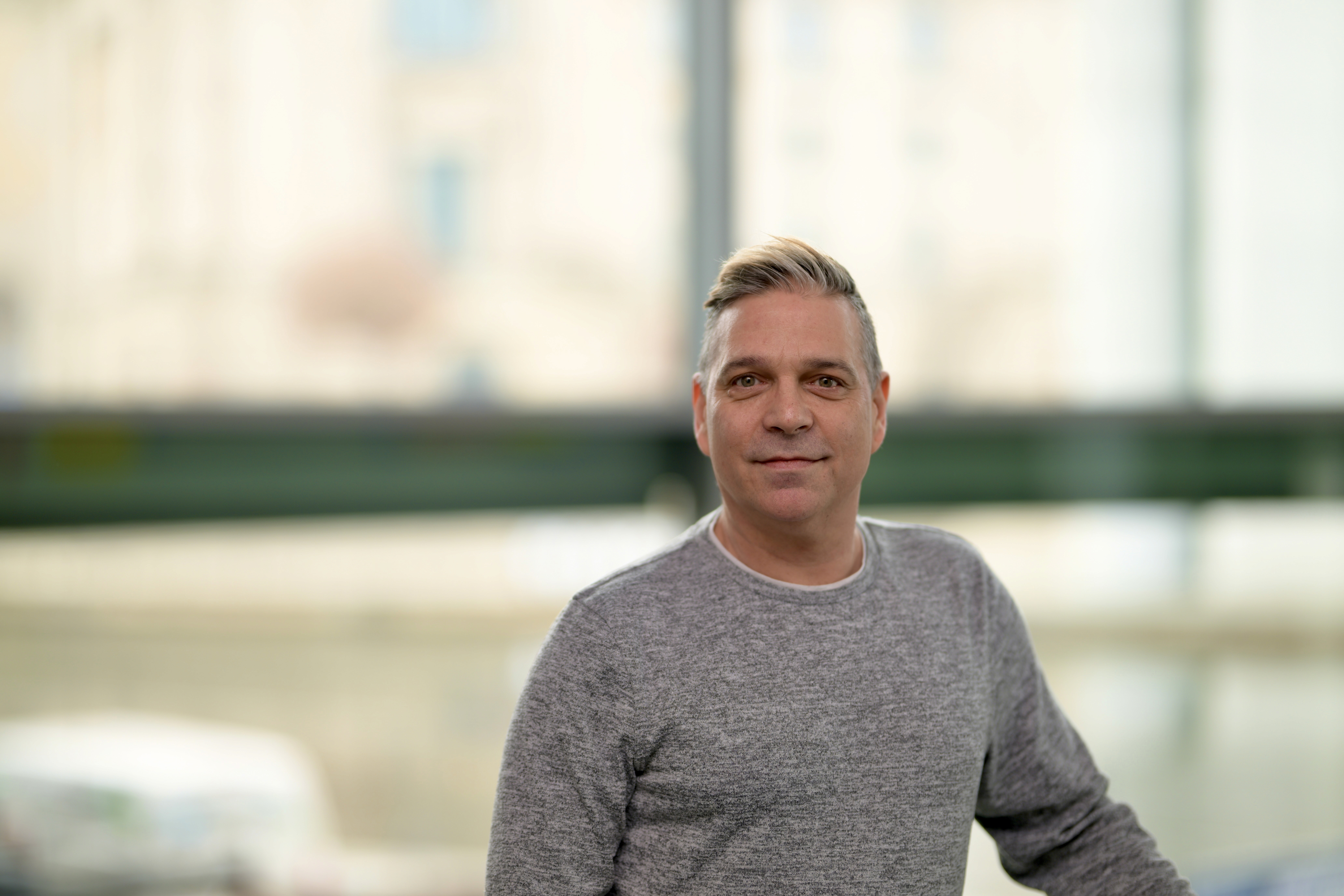 A young man riding a bicycle