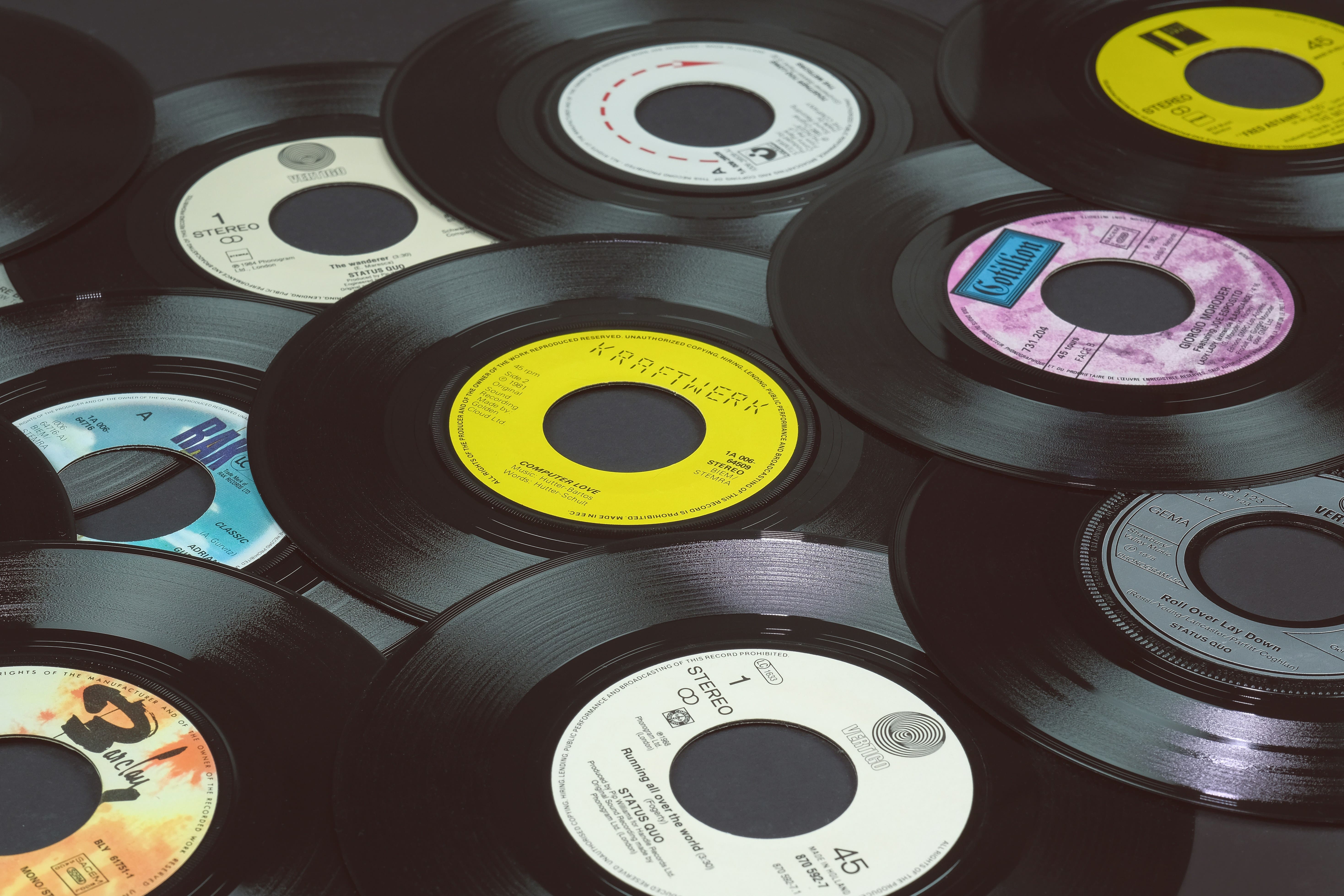 45 rpm vinyl records representing marketplaces where collectors buy records online
