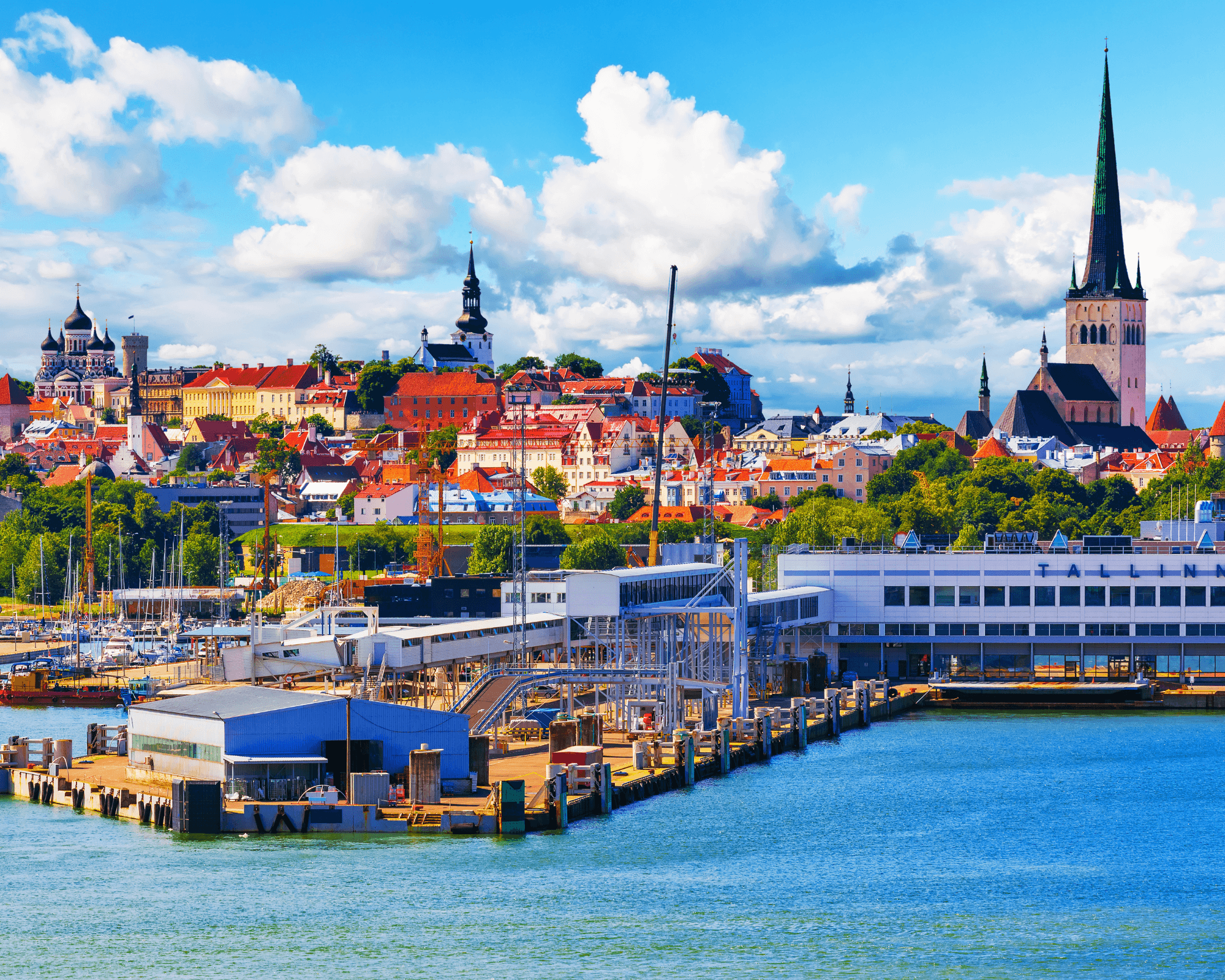 a bridge over a body of water with a statue on top