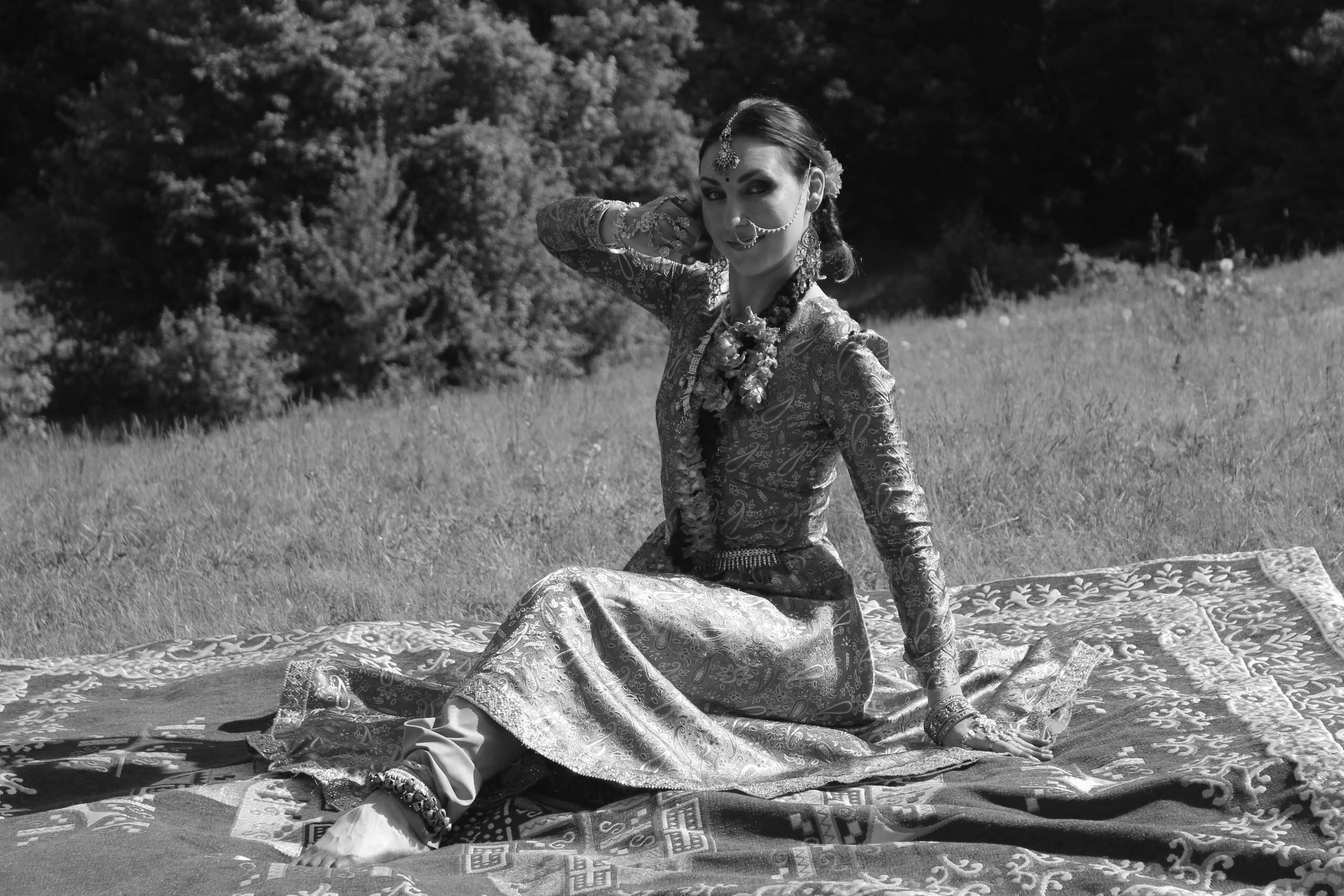 A person stands in a sandstone cave.