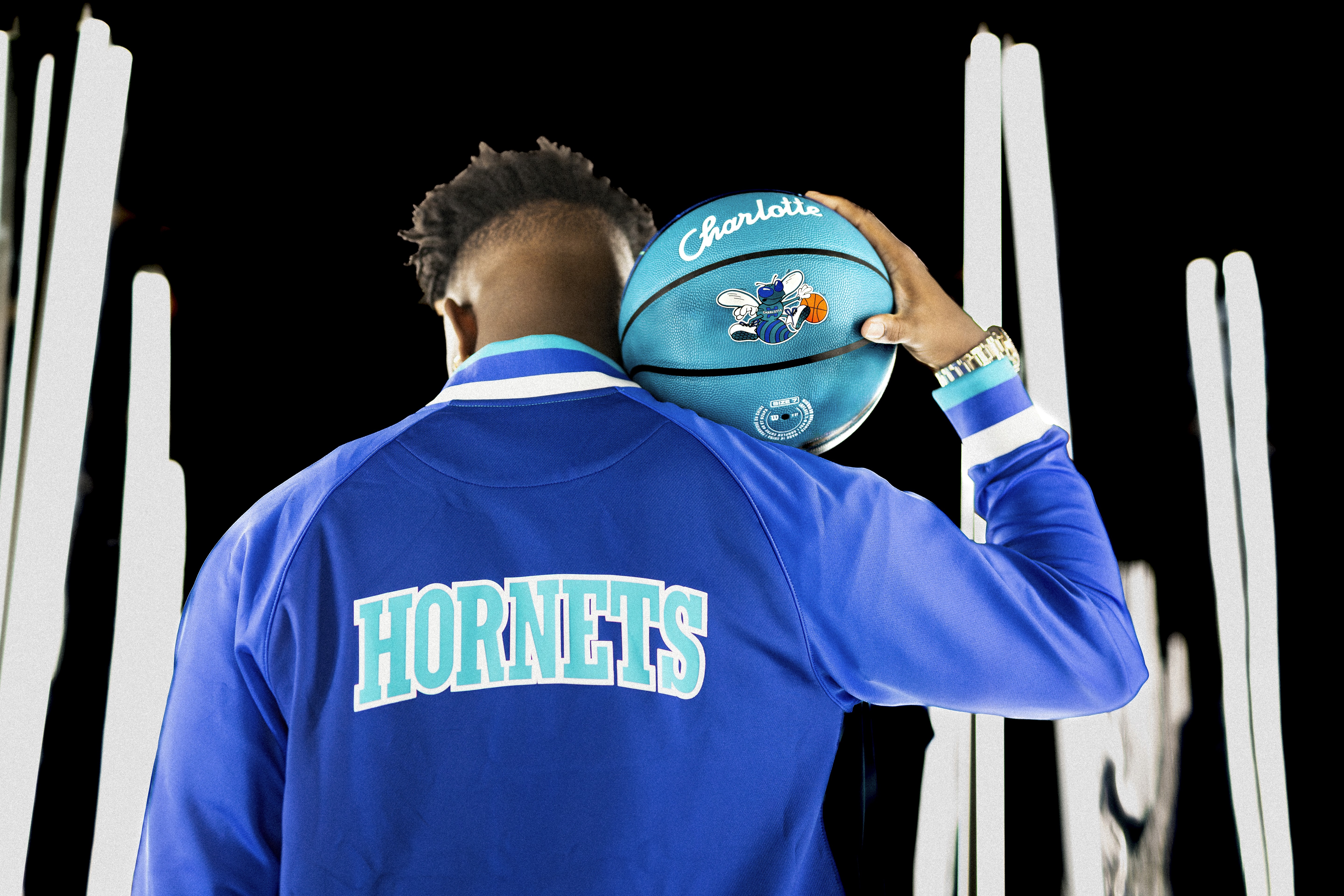 Clifford Taylor IV  flexing new Wilson Charlotte Hornets Basketball during branded campaign shoot in Los Angeles photos taken by Johnny Baru Media