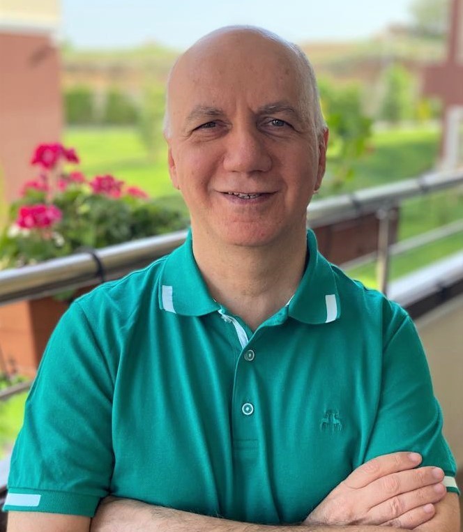woman in black crew neck t-shirt wearing brown framed eyeglasses standing on rocky shore during