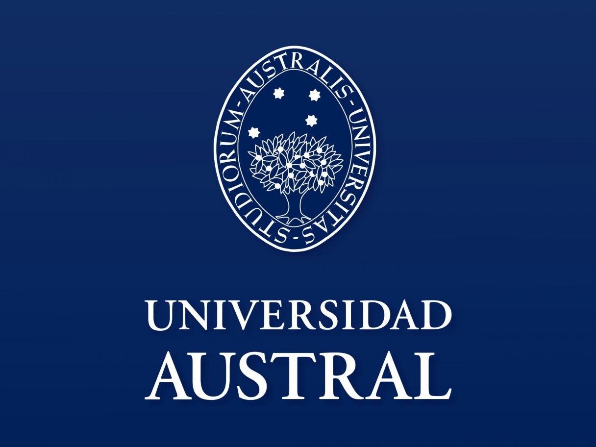 Rustic cabin in a golden field at sunset