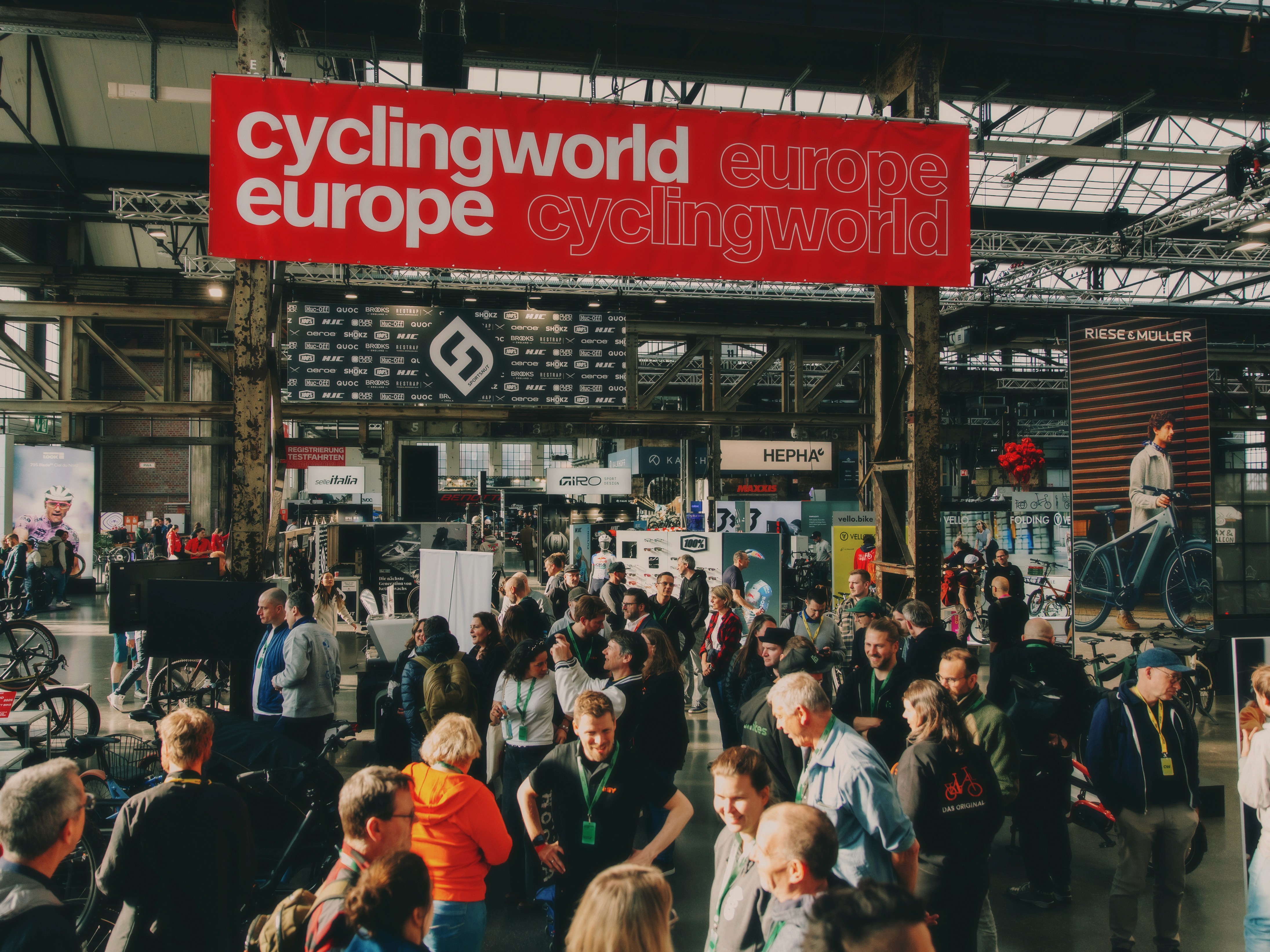 A smiling woman writing on a piece of paper in her home