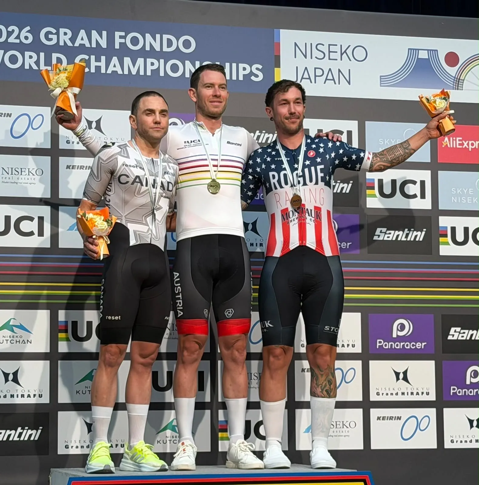 The M35-39 time trial podium at the 2026 UCI Gran Fondo World Championships, with Zack Morris in second