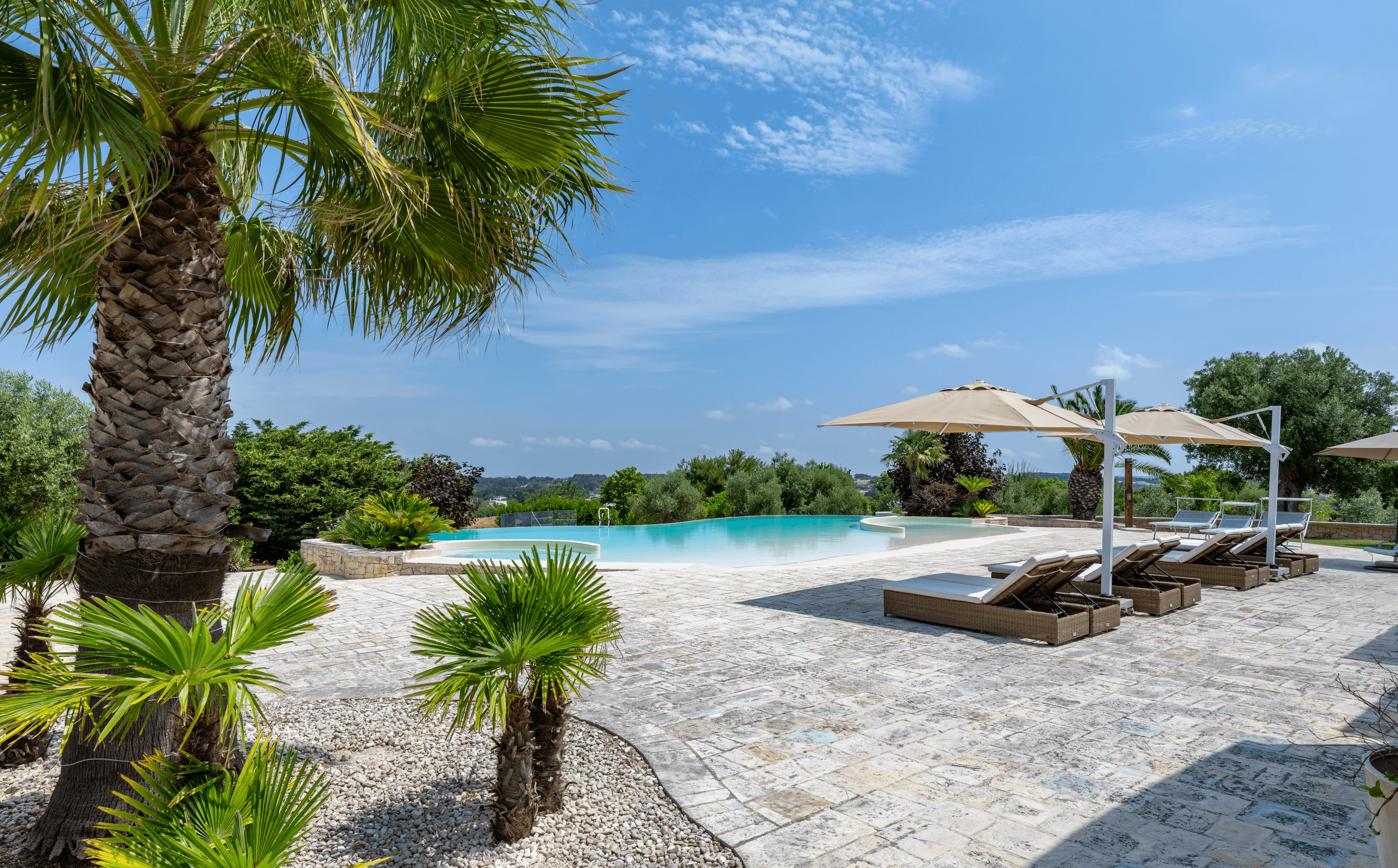 Modern hillside home with terracotta urn and mountain view