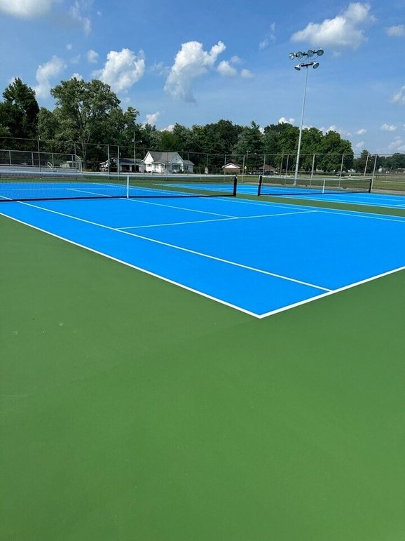 Outdoor tennis court restored with professional resurfacing