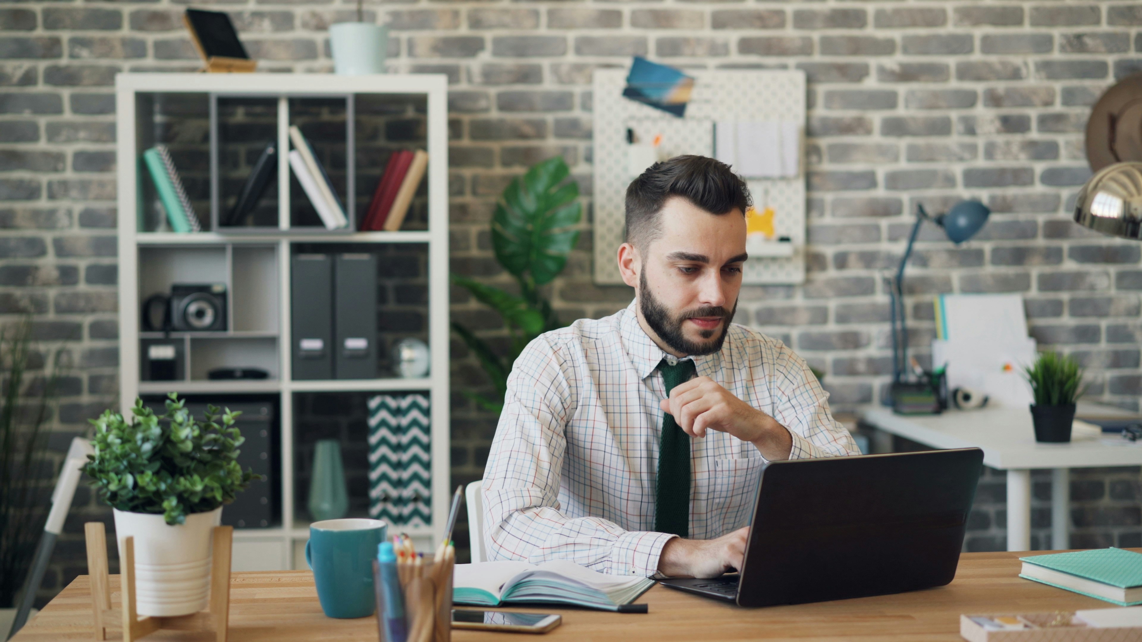 student sitting alone and working - DocLime