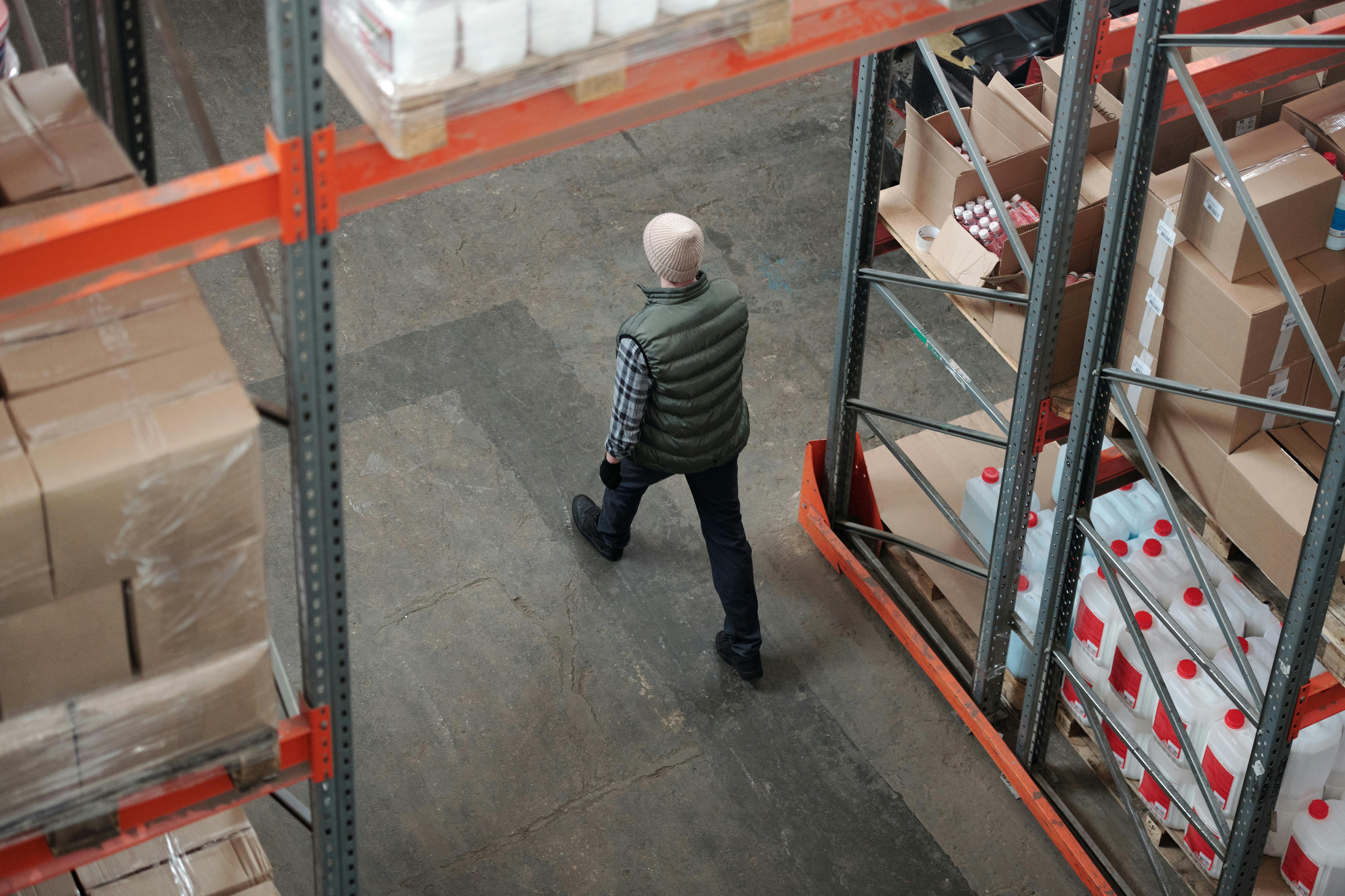 Warehut - What is an ecommerce 3PL? Image of a man walking through a warehouse