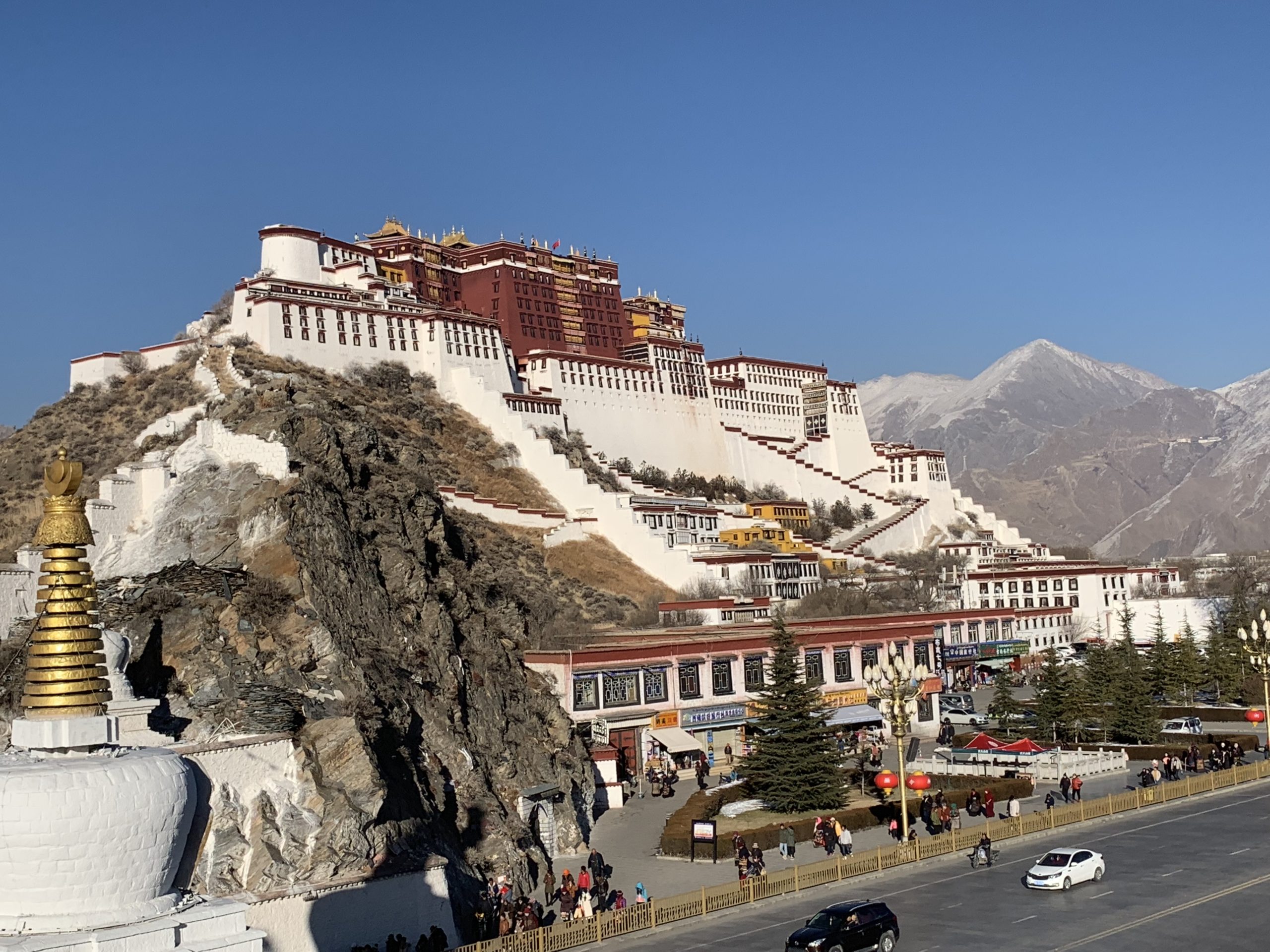 The potala palace stands majestically in the distance.
