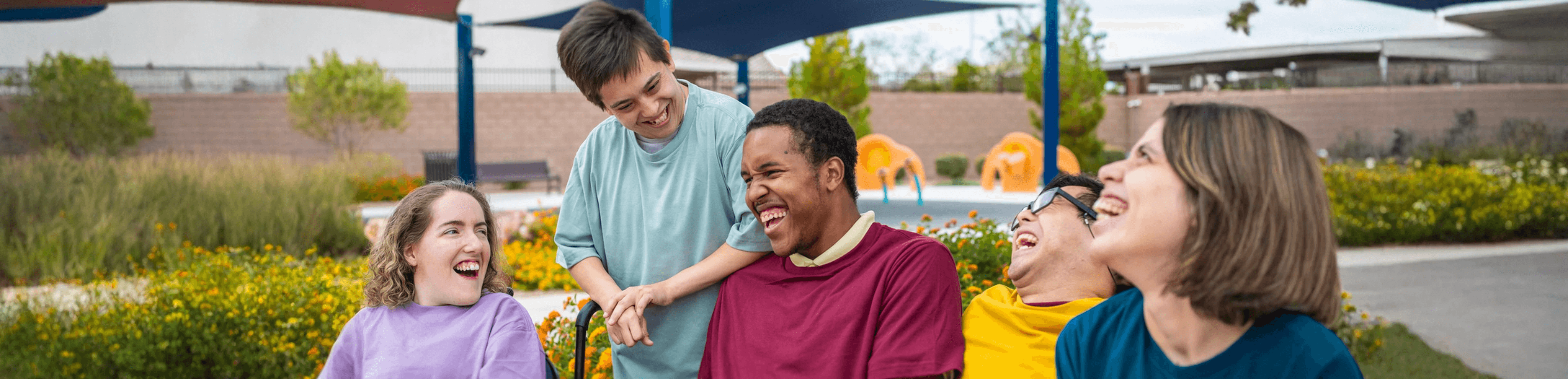 young people having fun on boardwalk at ocean