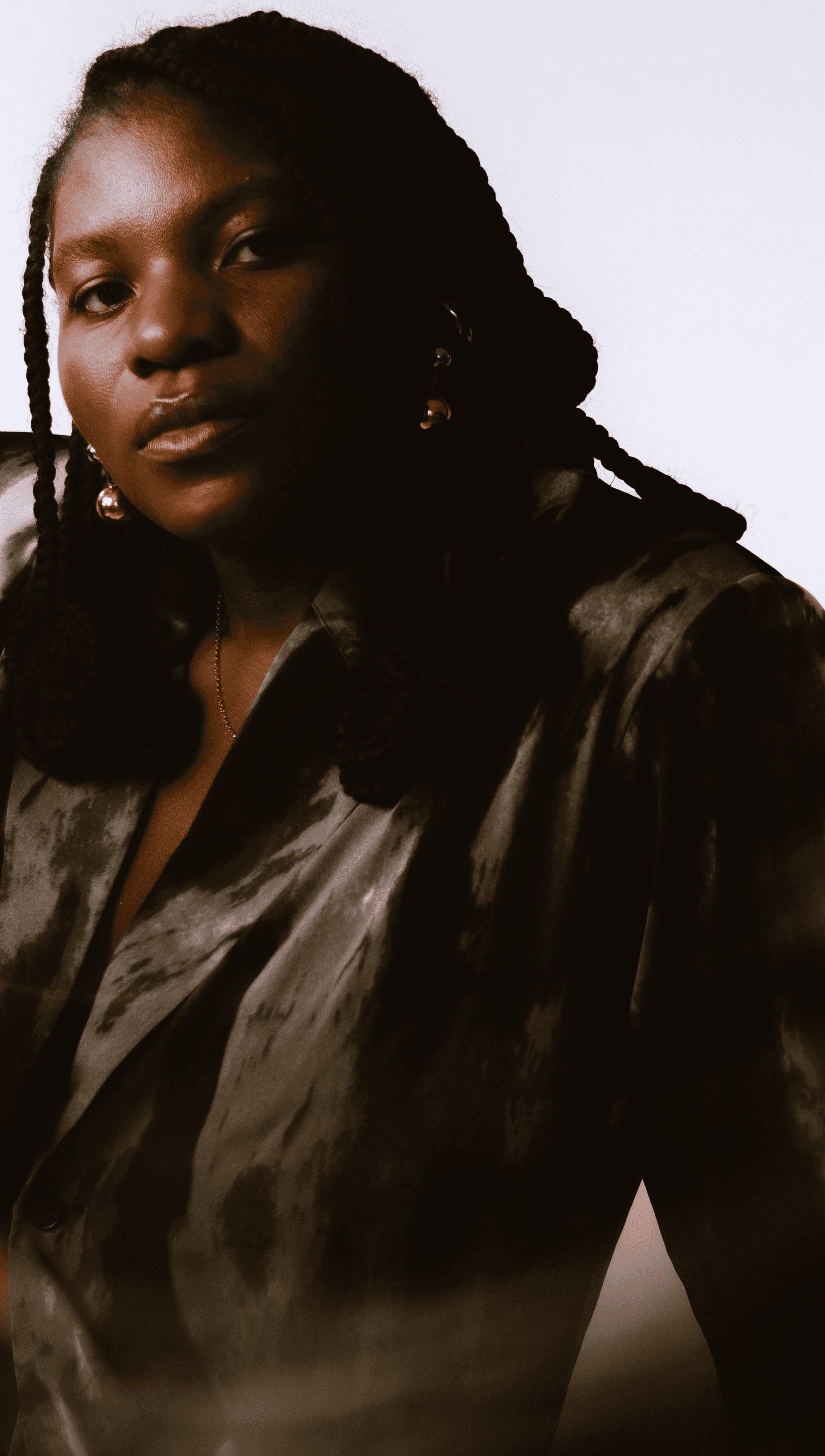 Dali Adekunle Creative Director and Actor in New York photo action headshots sitting bac