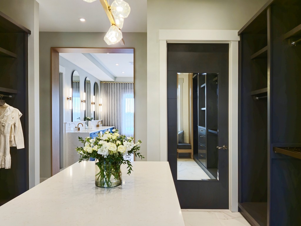 Image of KHD Homes primary ensuite with marble countertop, furniture, and window coverings showcasing interior design and construction.