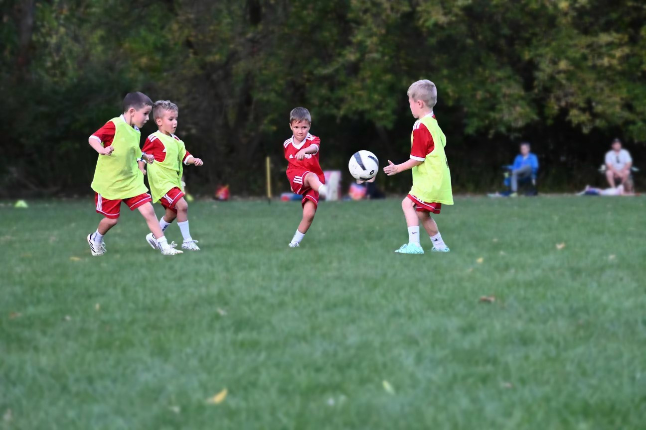 German Canadian soccer player kicking ball