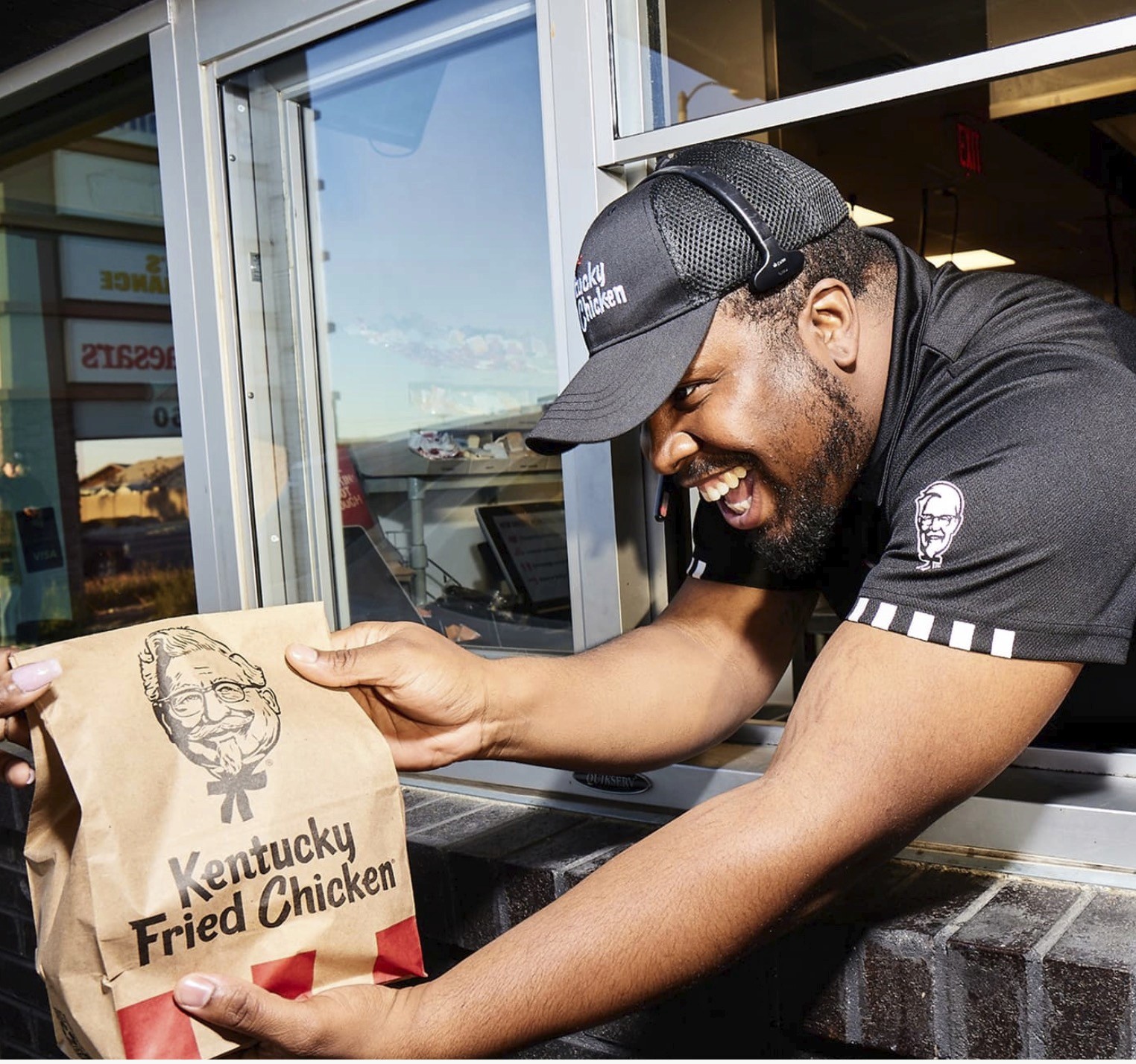 Minimalist brushed-steel chair in a white corner studio—industrial, brutalist modern furniture.