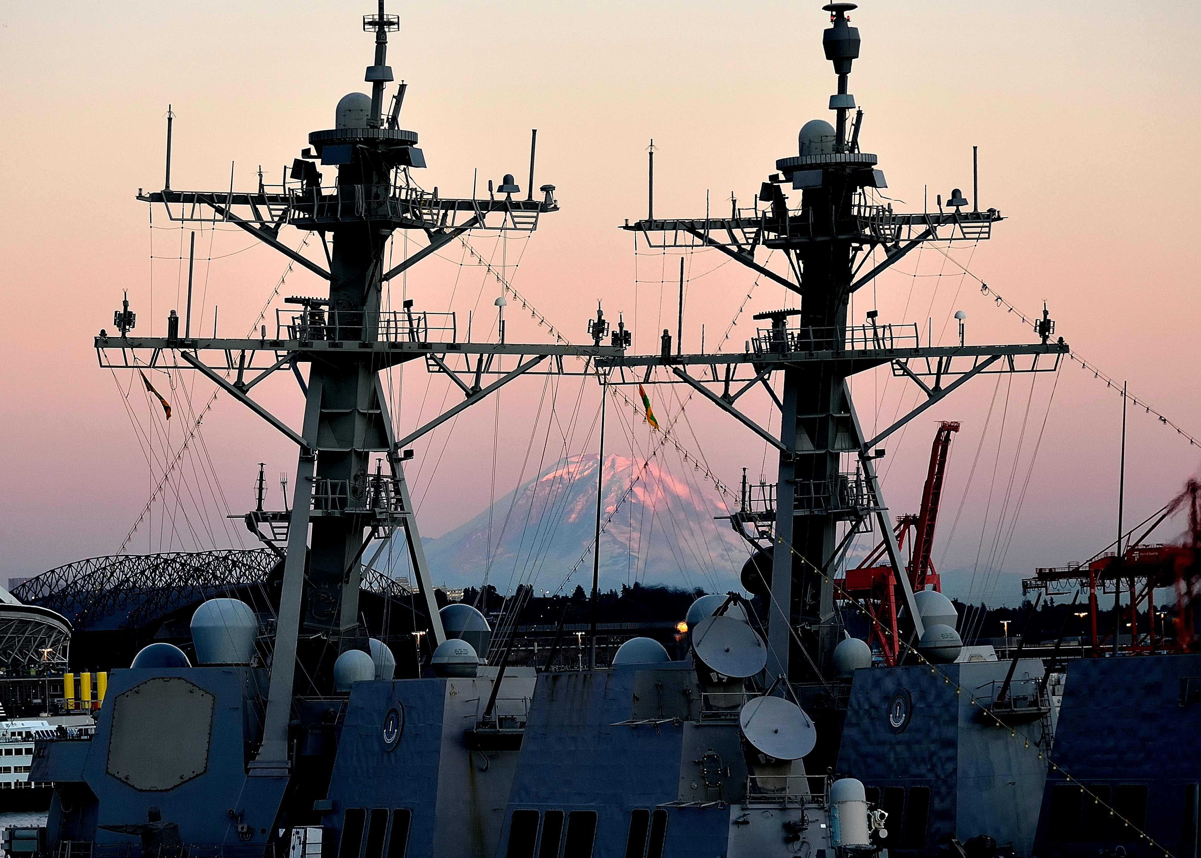 navy ships with mountain sunset