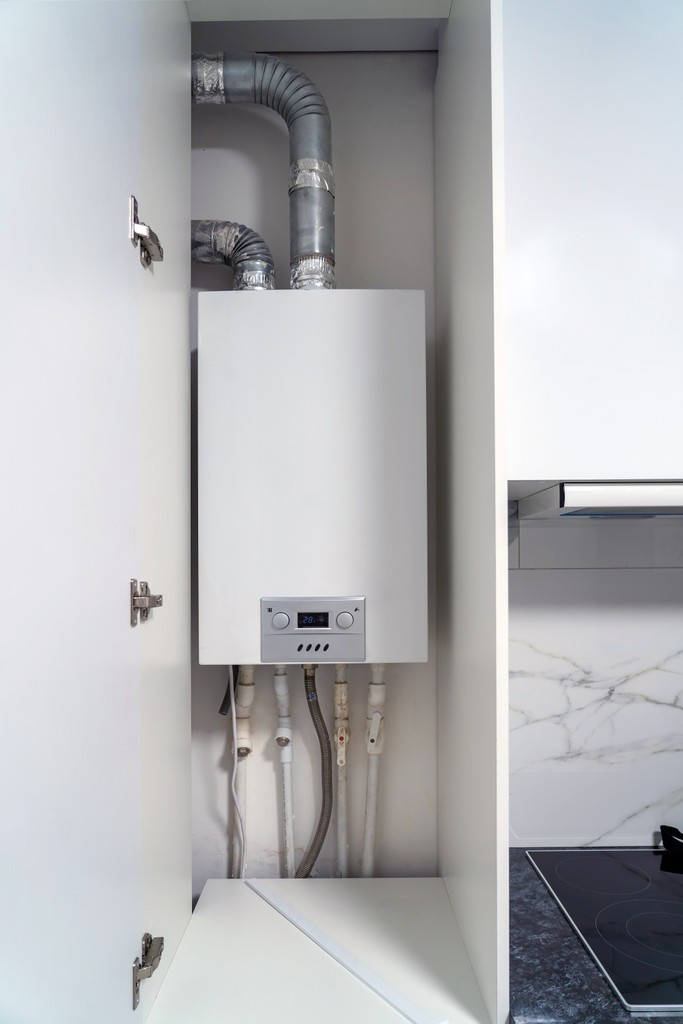 An engineer conducting a boiler installation service