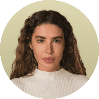 woman in white crew neck shirt smiling