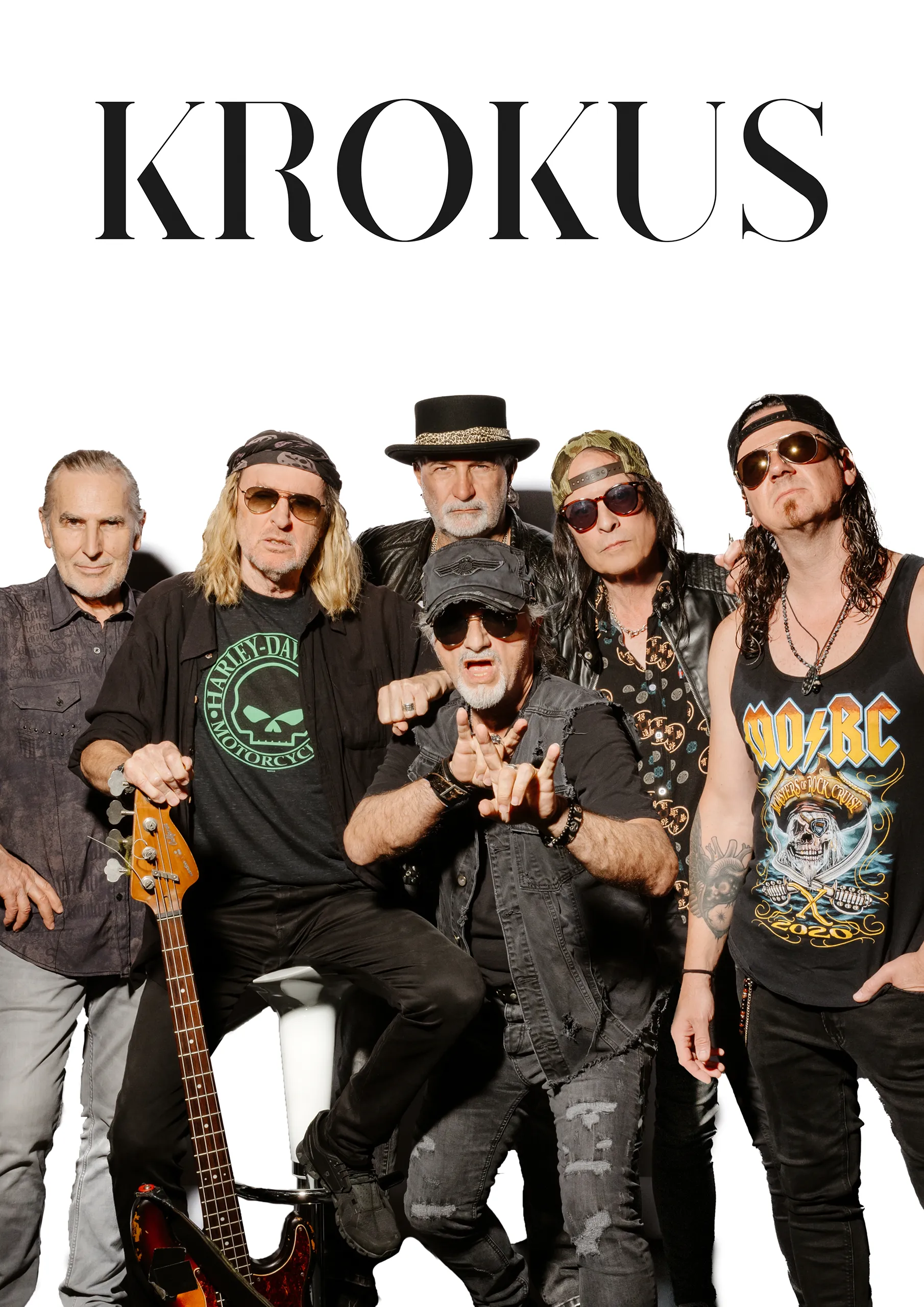 A group portrait of the legendary rock band Krokus with their logo in the corner.