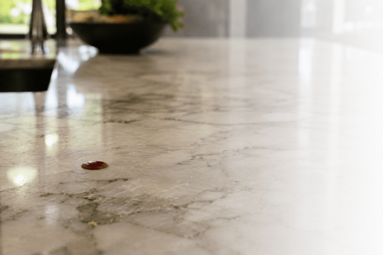 Water beading on a residential marble countertop protected with MORE™ AntiEtch™.