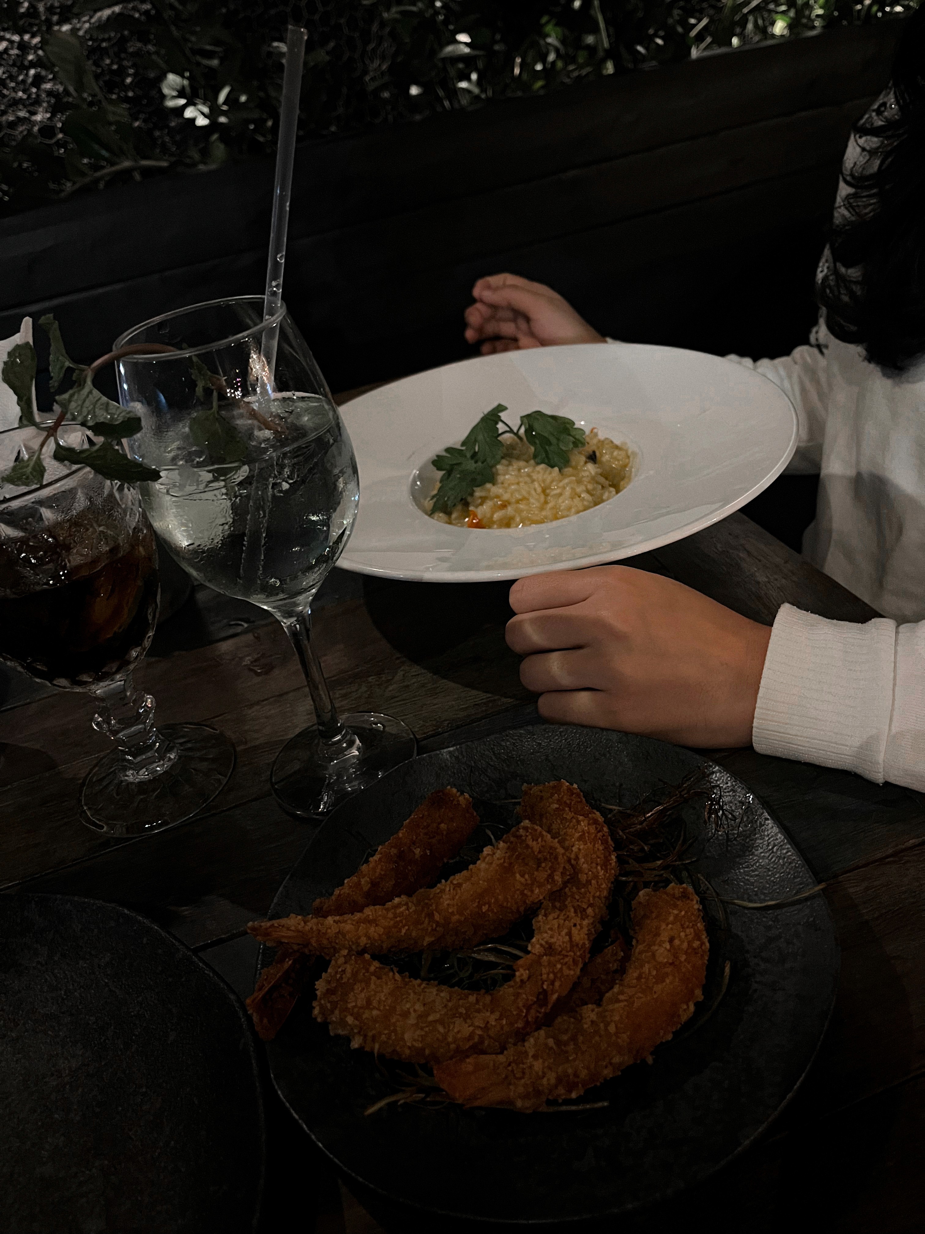 a group of people walking on a sidewalk