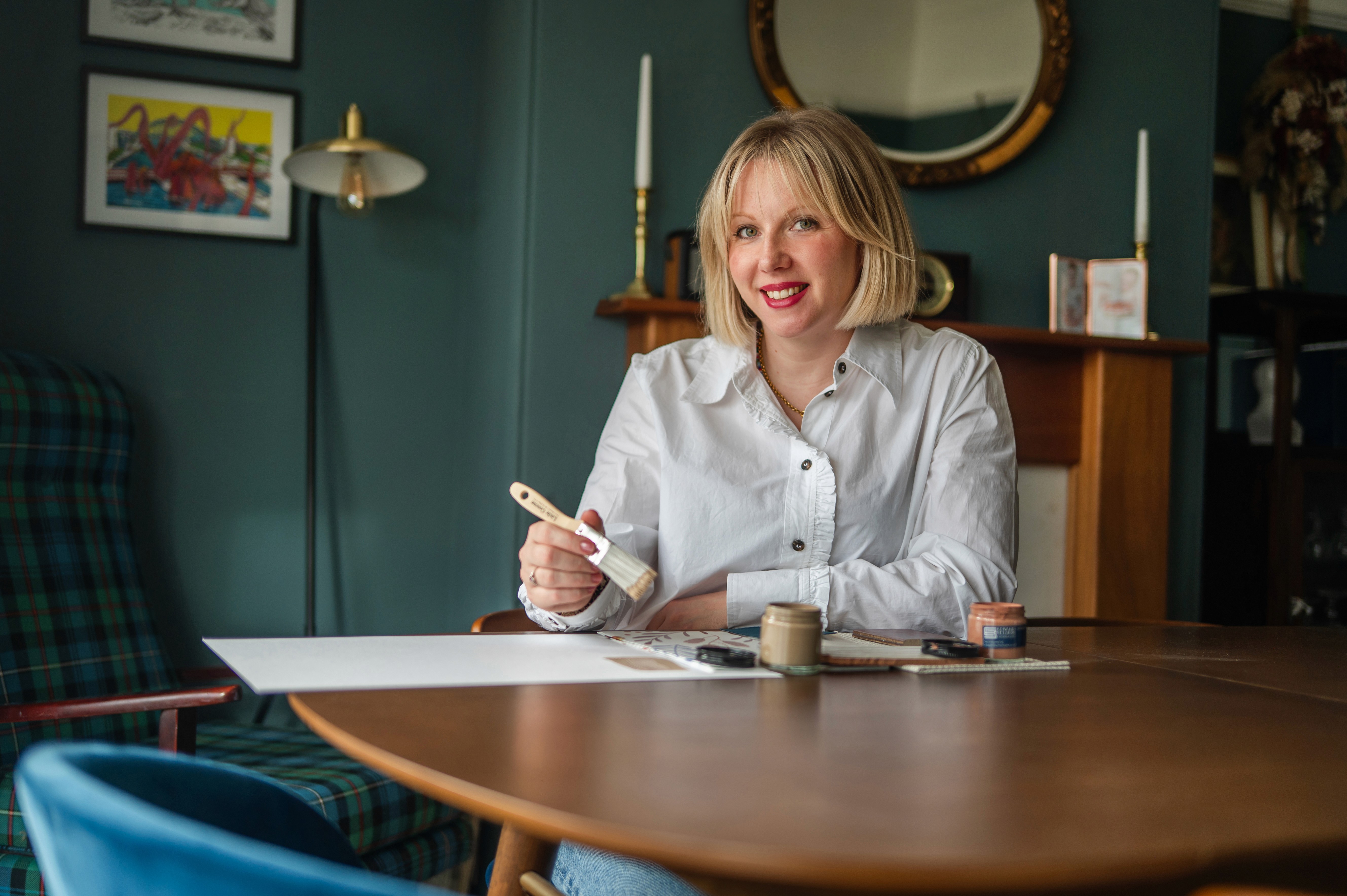 Background image featuring a modern interior design space for the testimonial Card