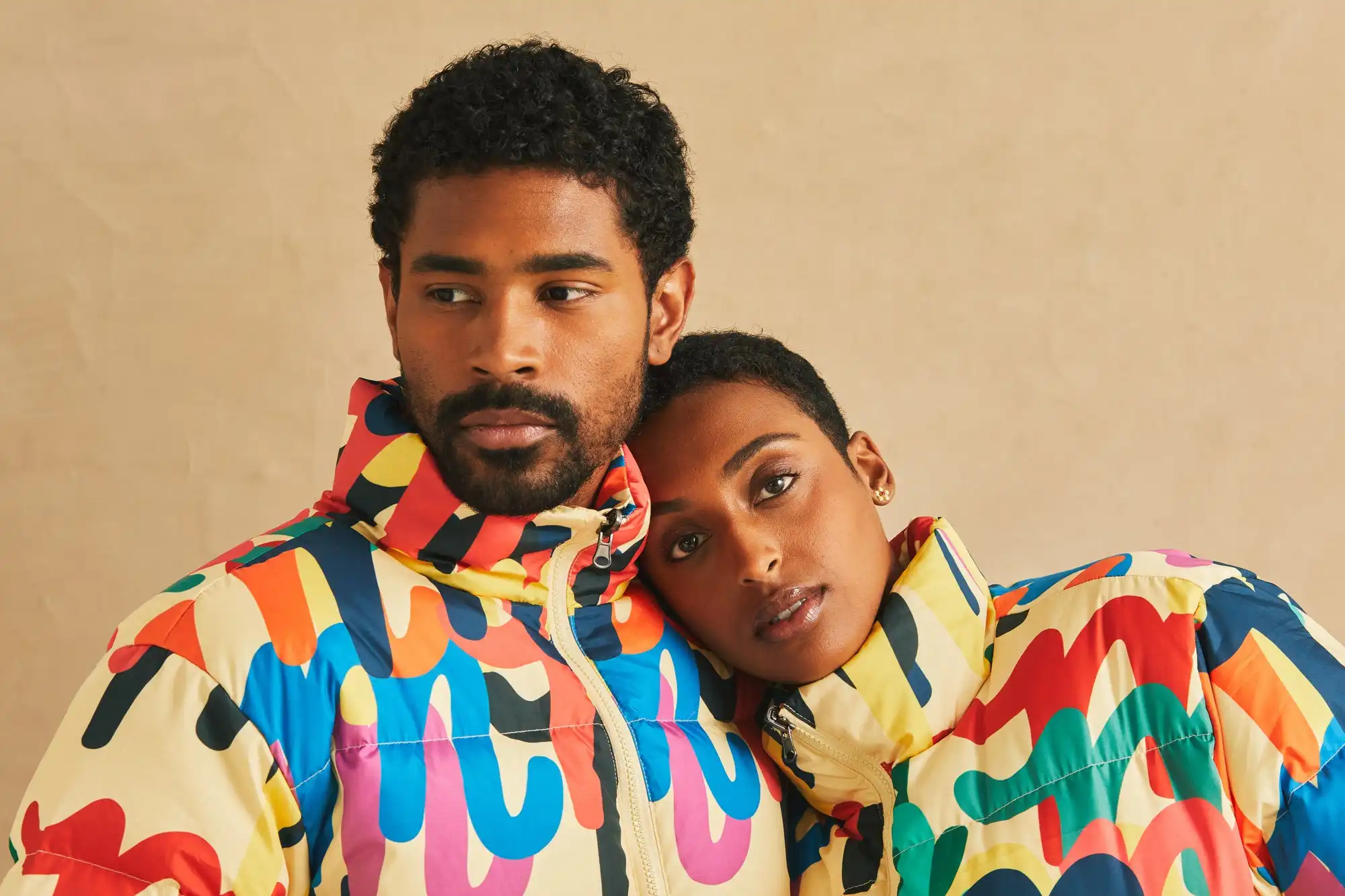 White branded cap with turquoise logo placed on fresh lemons in a red bowl