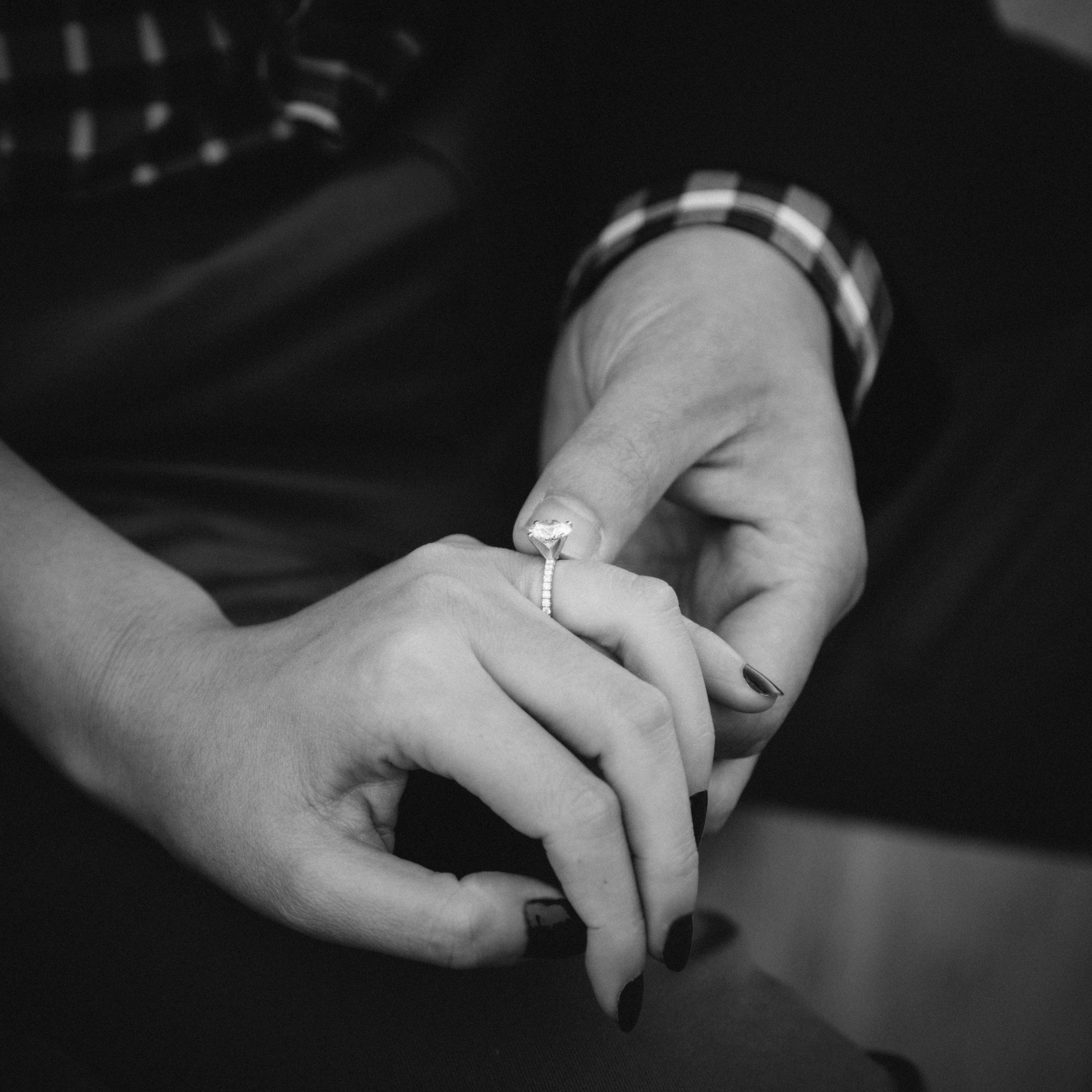 Hands showing engagment ring