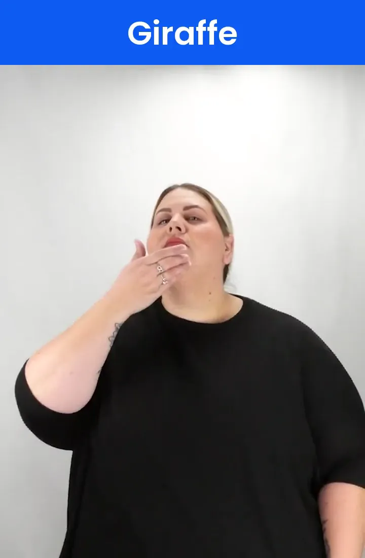 A Deaf signer signs GIRAFFE in ASL