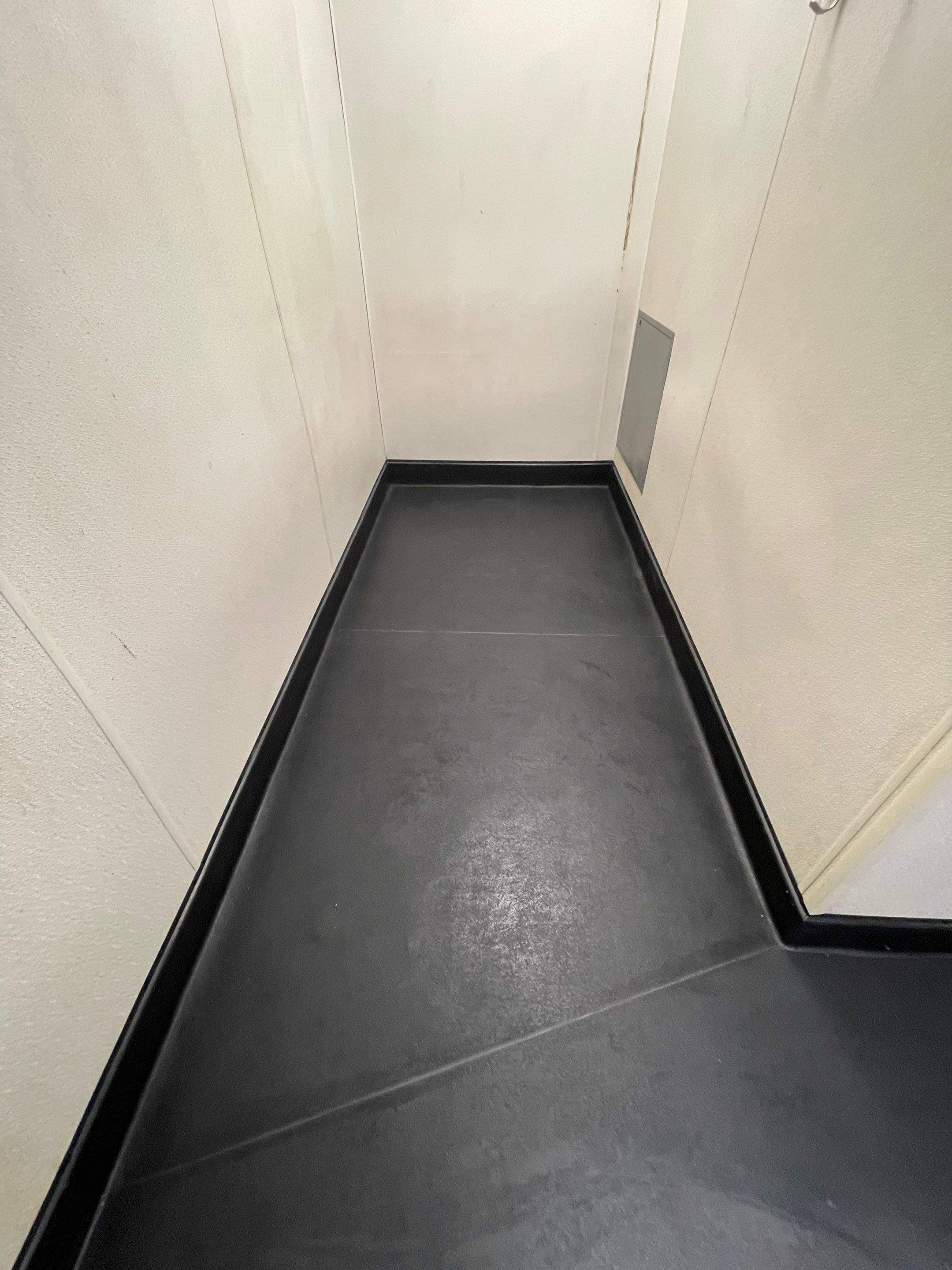 Bright, finished Eco-Grip floor showing consistent color and a smooth, durable surface throughout the workspace.