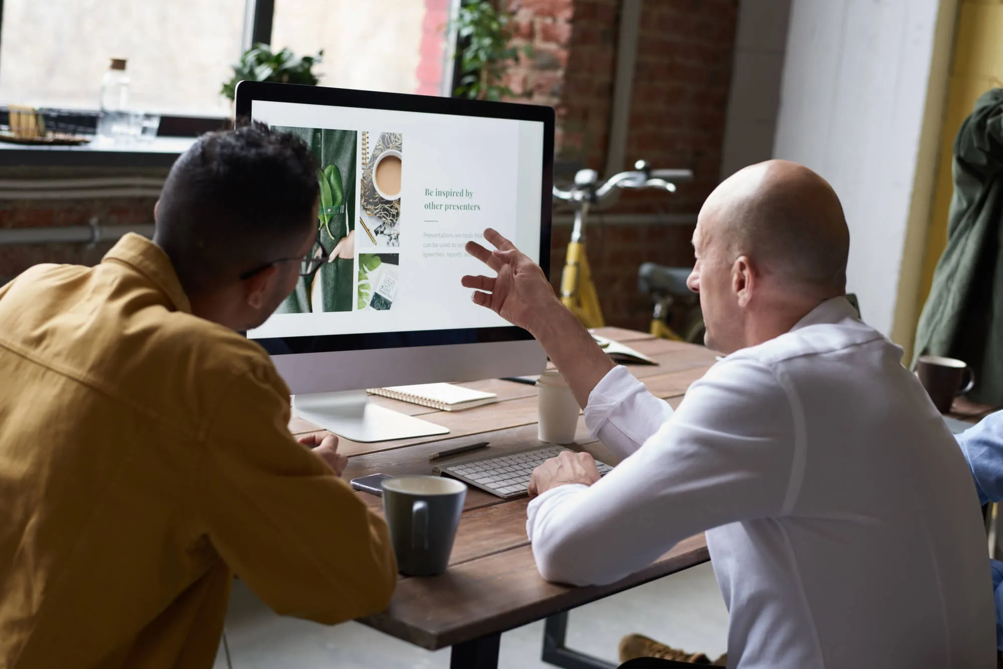 Auckland website designer working on a laptop developing a modern business landing page.