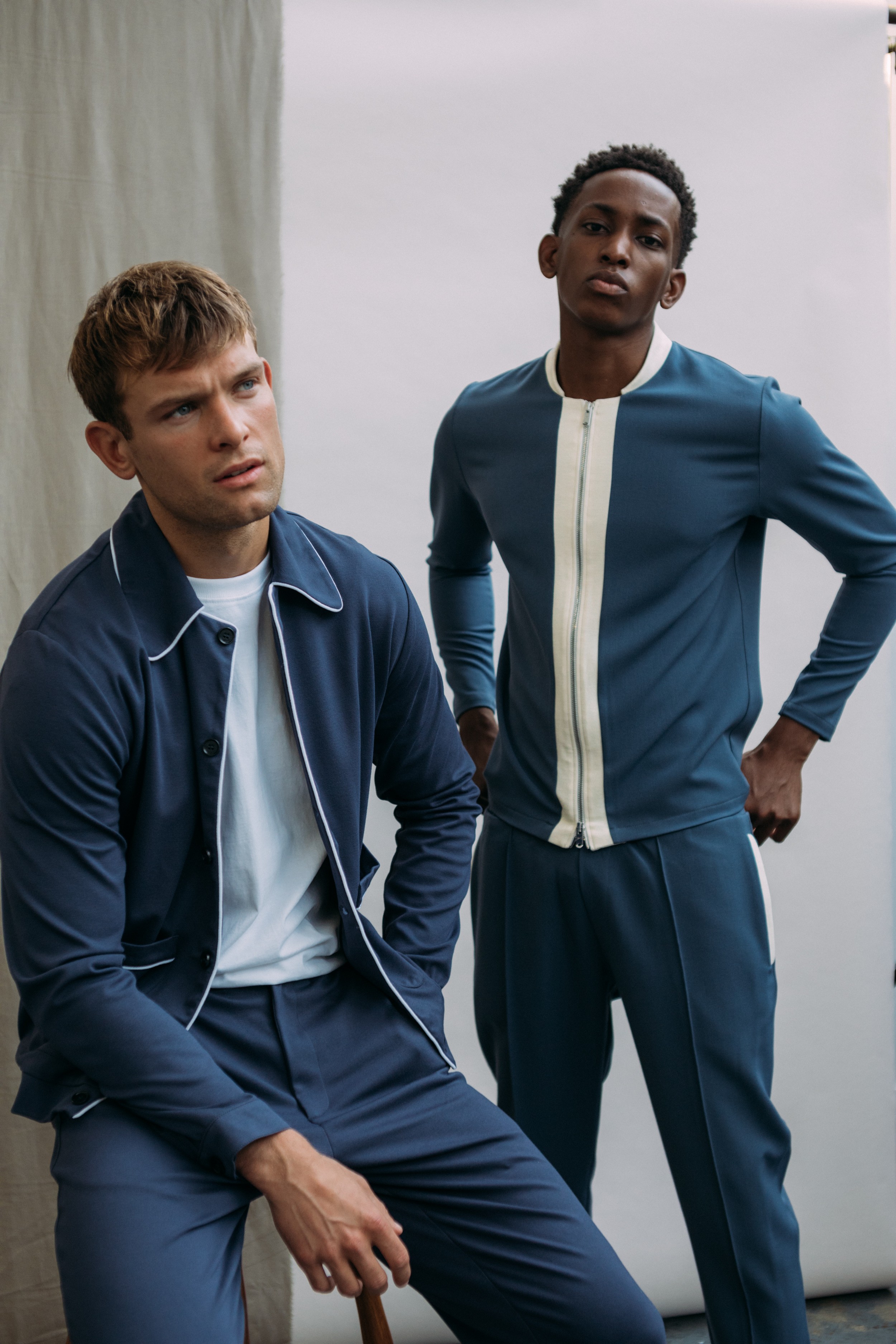 Two models wearing blue Prévu clothing