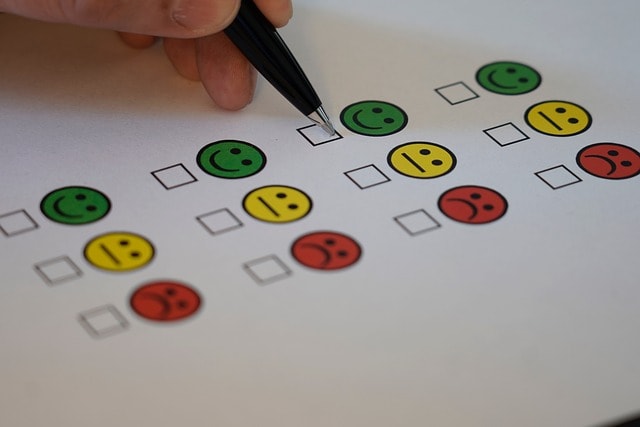 Hand filling out a multiple-choice survey