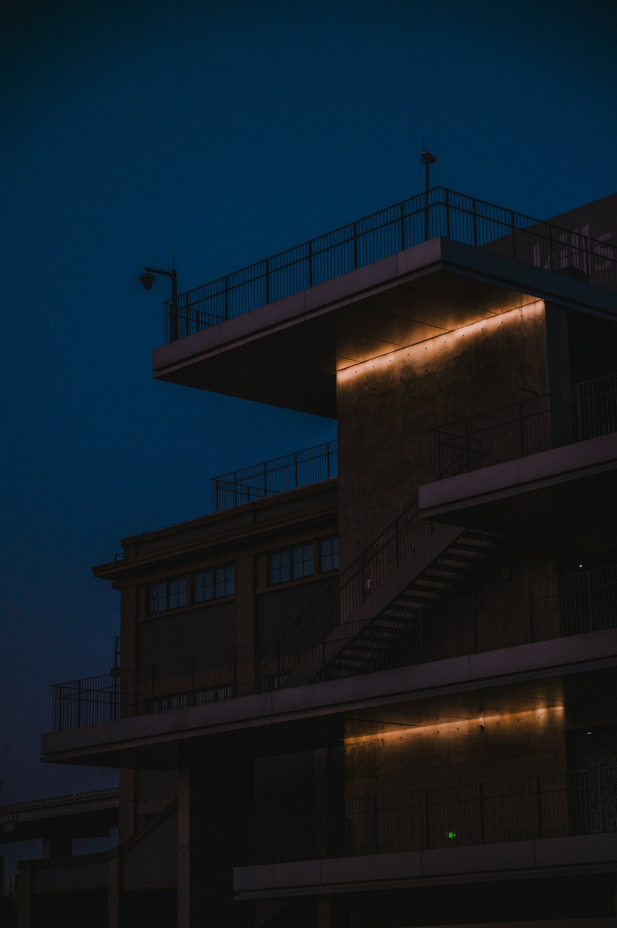 Modern building with illuminated accents at dusk