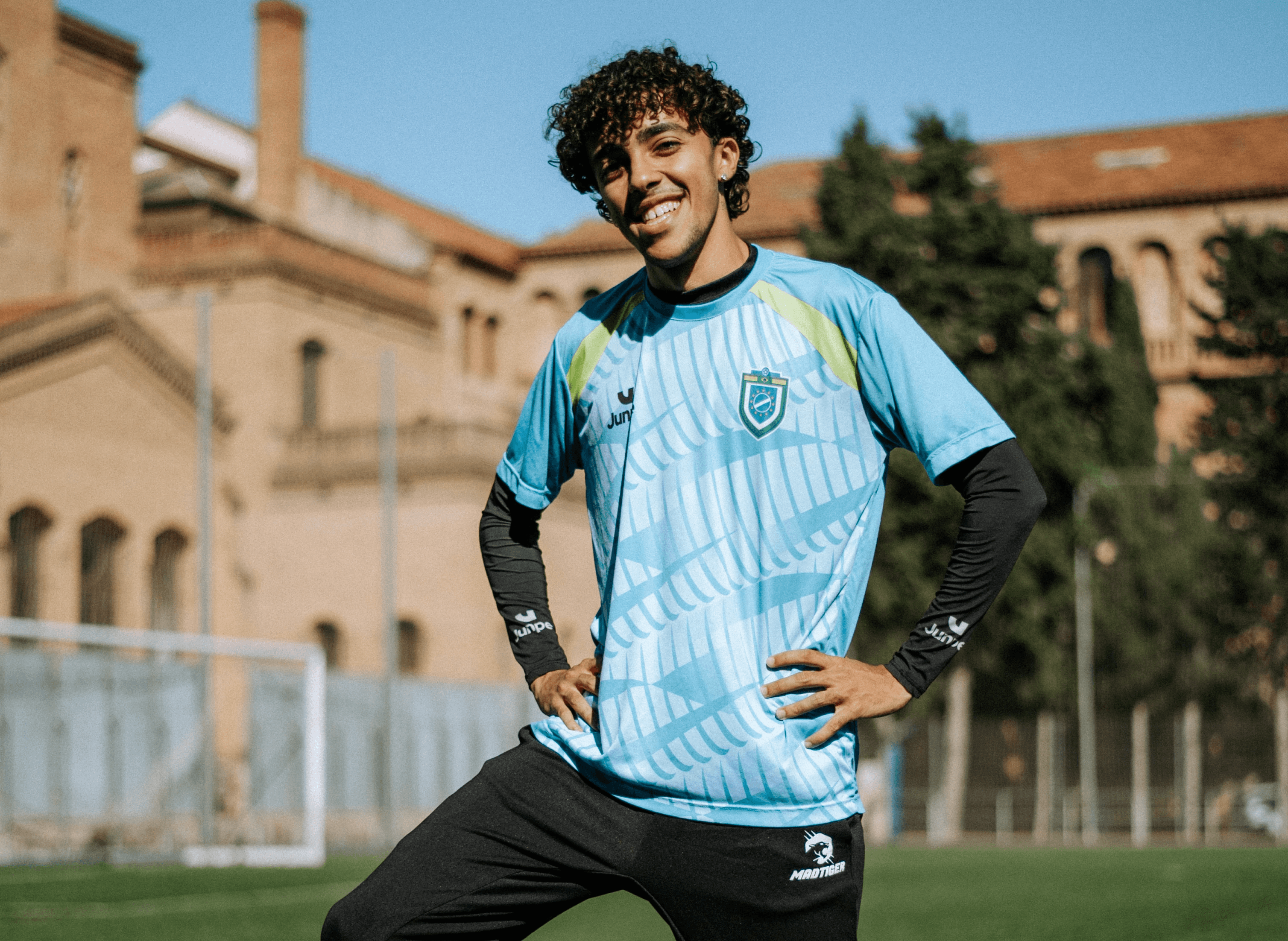 Edi quieixinho wearing a ousadia football club jearsey