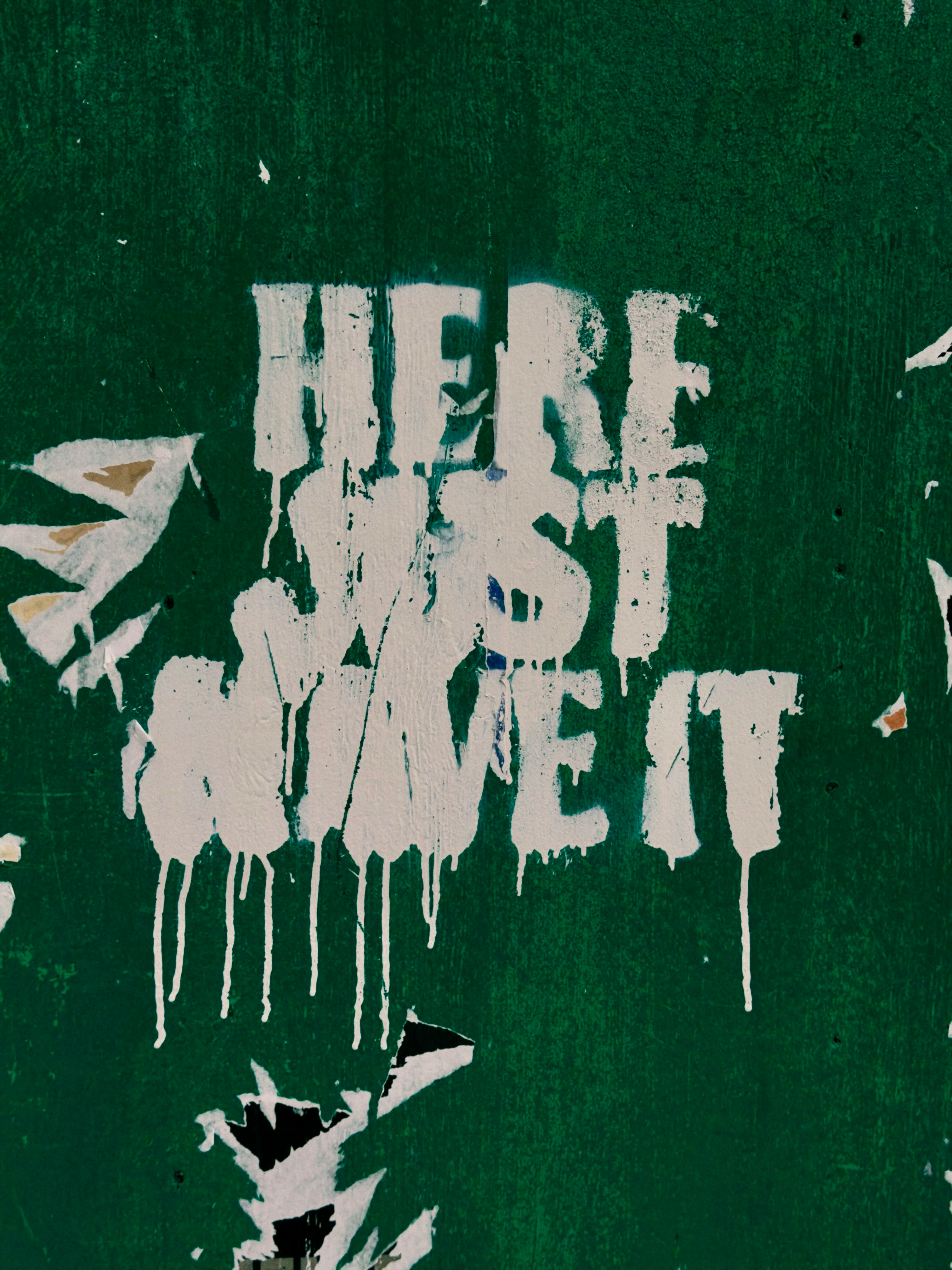 White text on green wall says "here just move it"