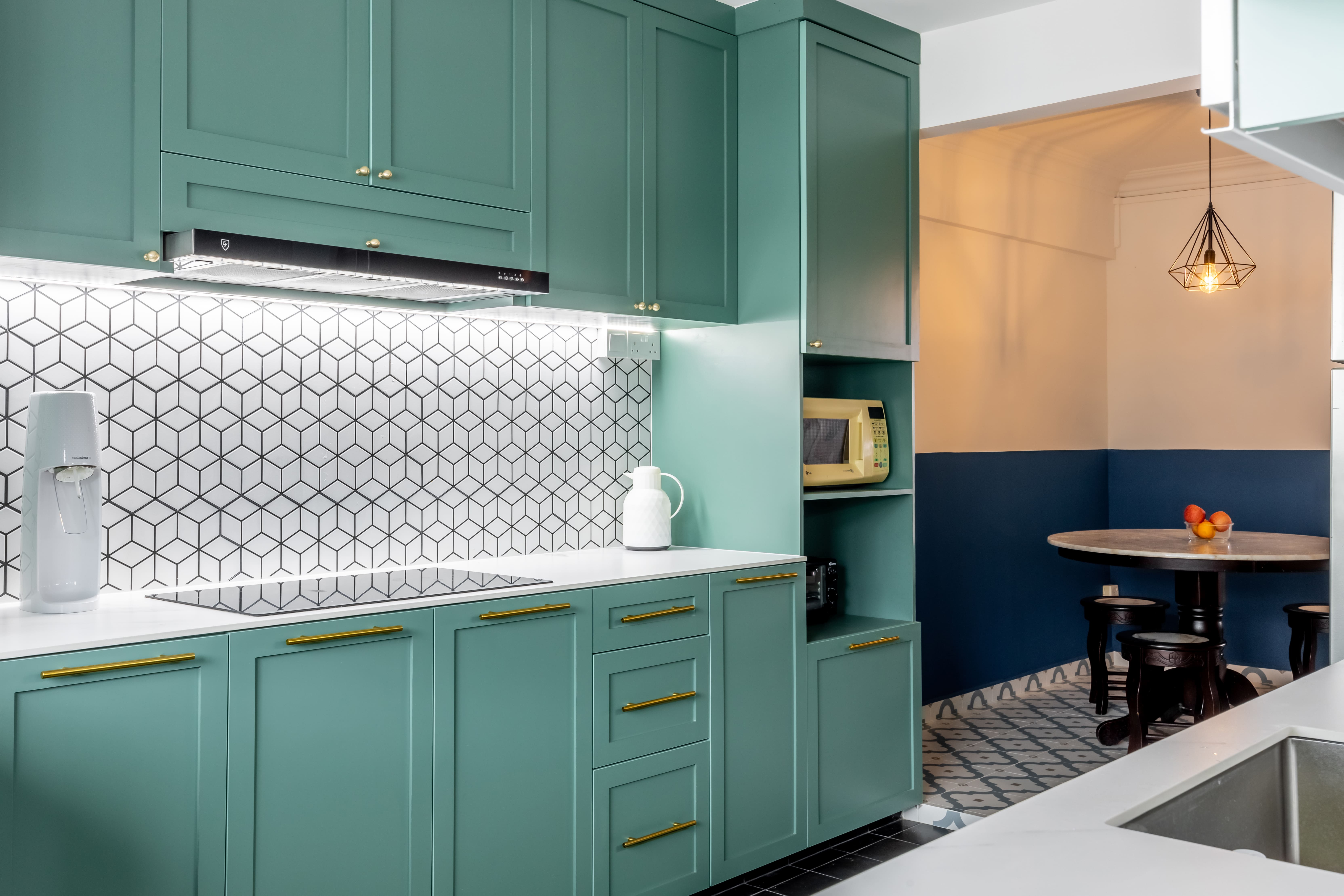 Mix of patterned and dark tiles unifying kitchen flooring.