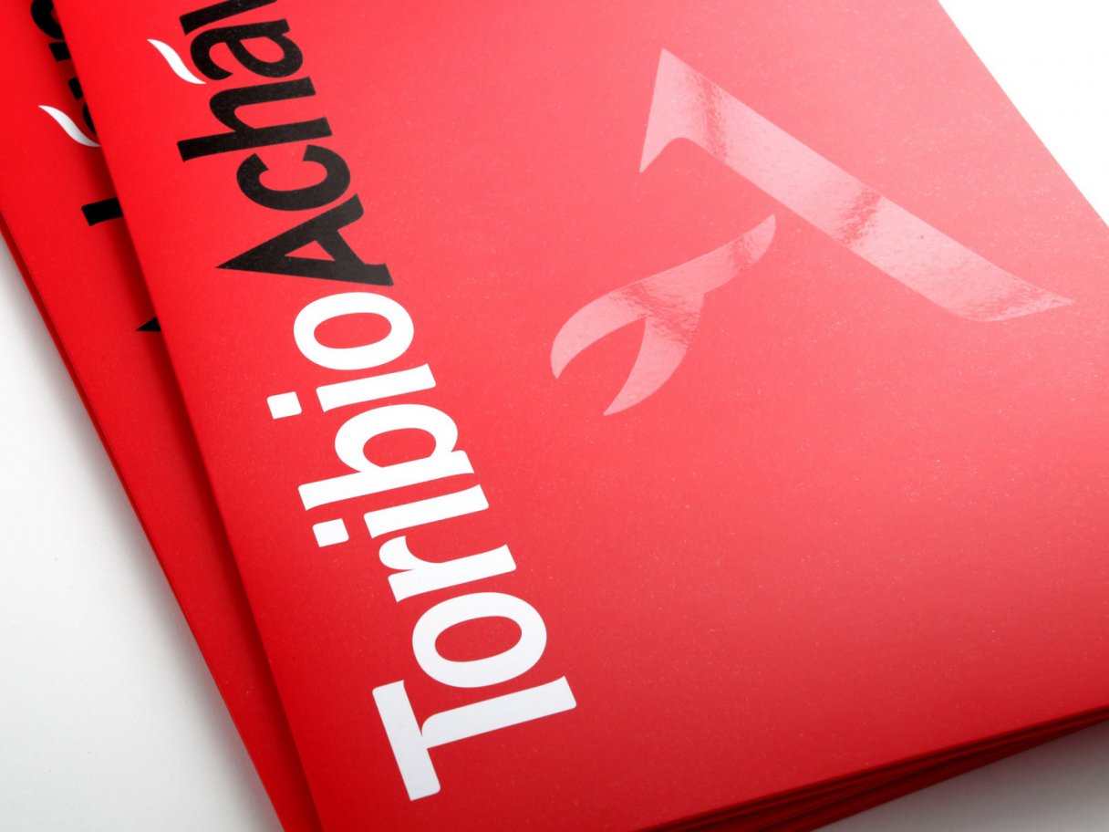 Rooftops of a coastal town with the sea in background